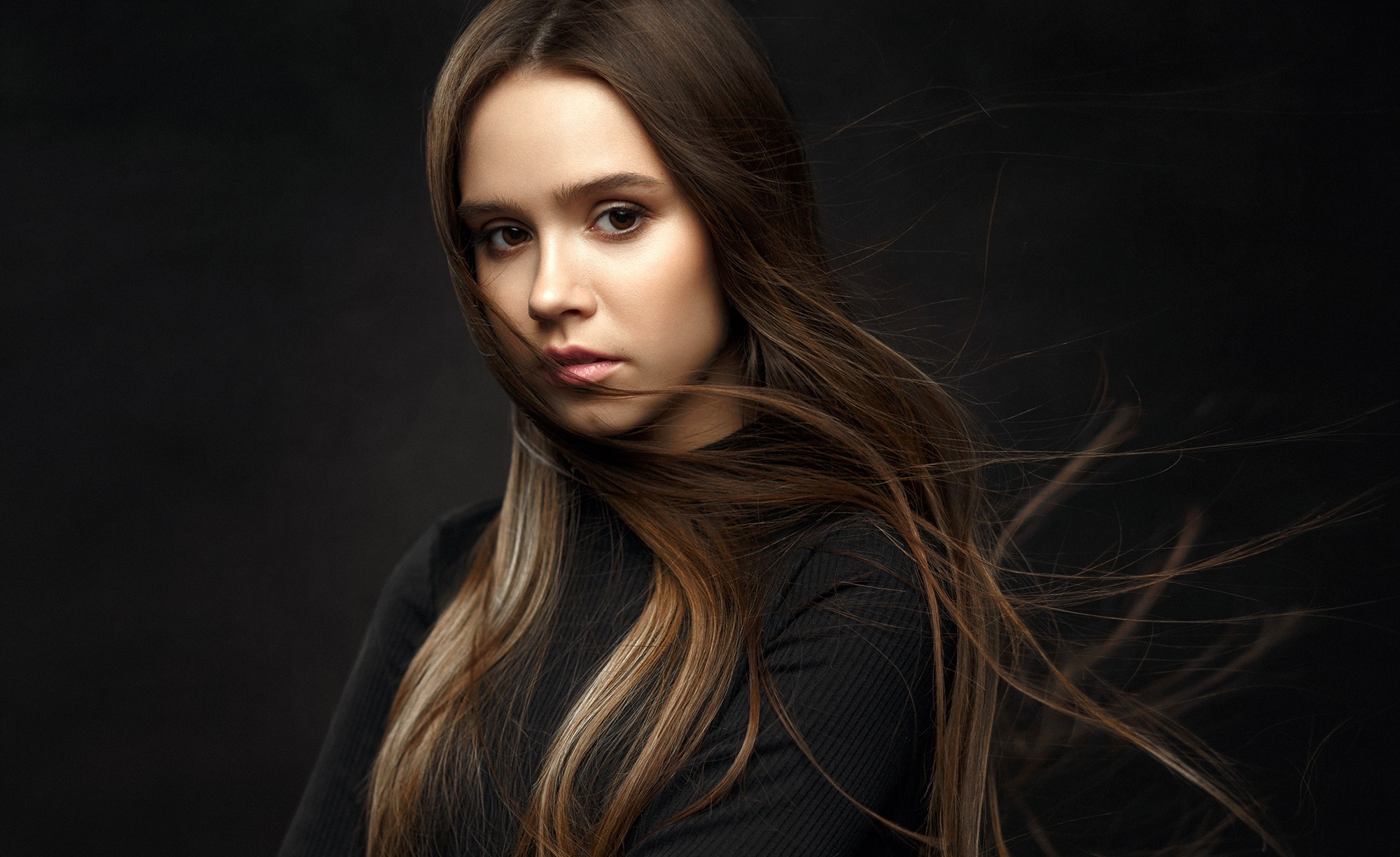 Brunette woman with flowing hair HD Wallpaper