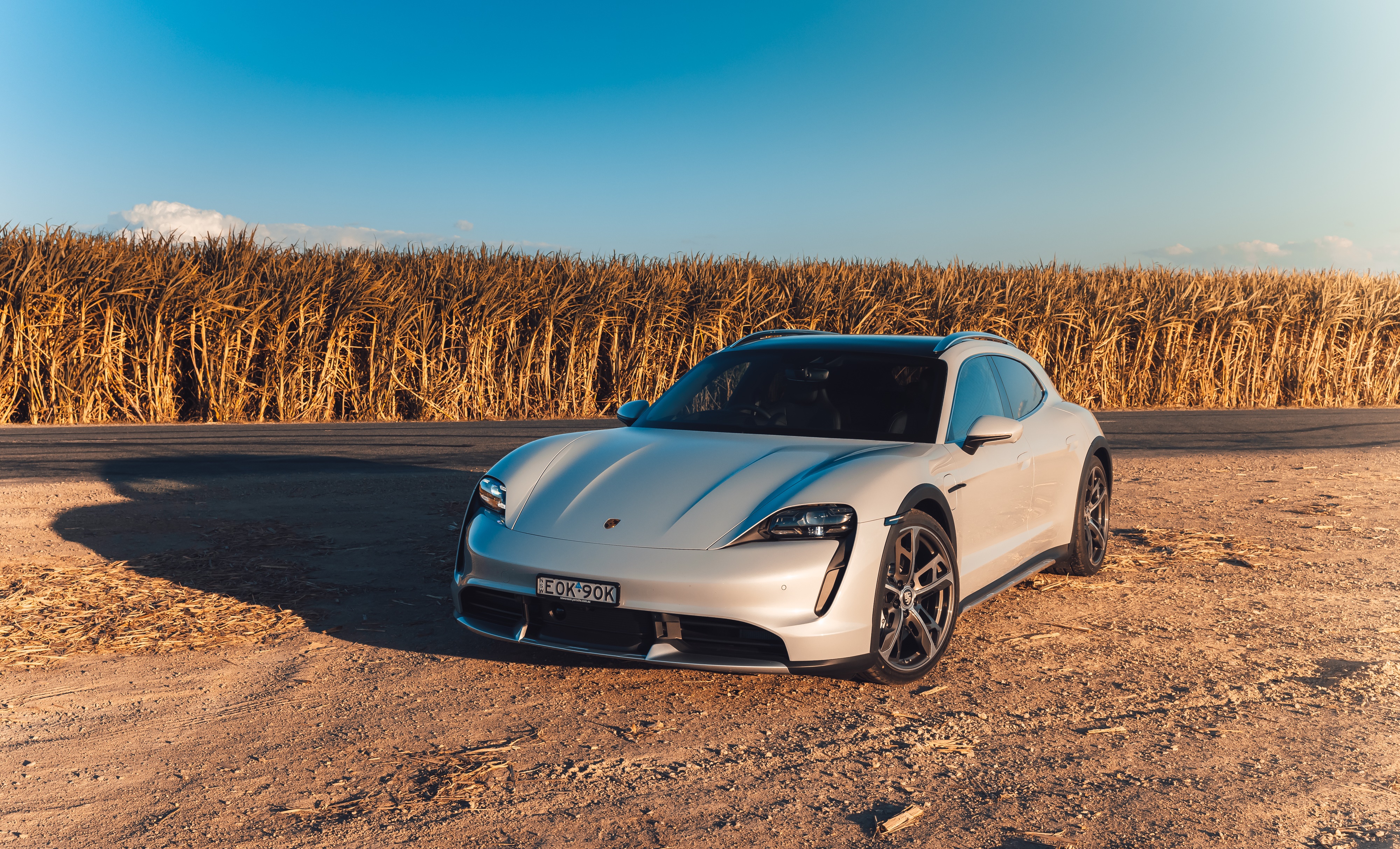 Porsche Taycan Turbo Cross Turismo in a field HD Wallpaper