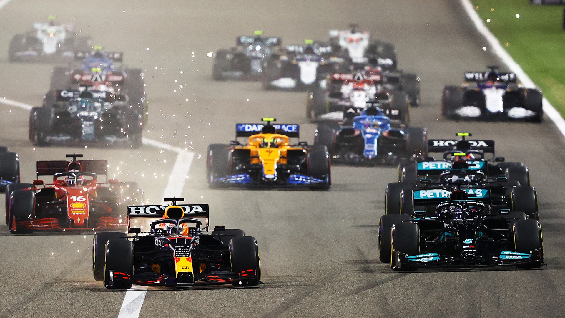 Formula 1 Cars Racing on Track HD Wallpaper
