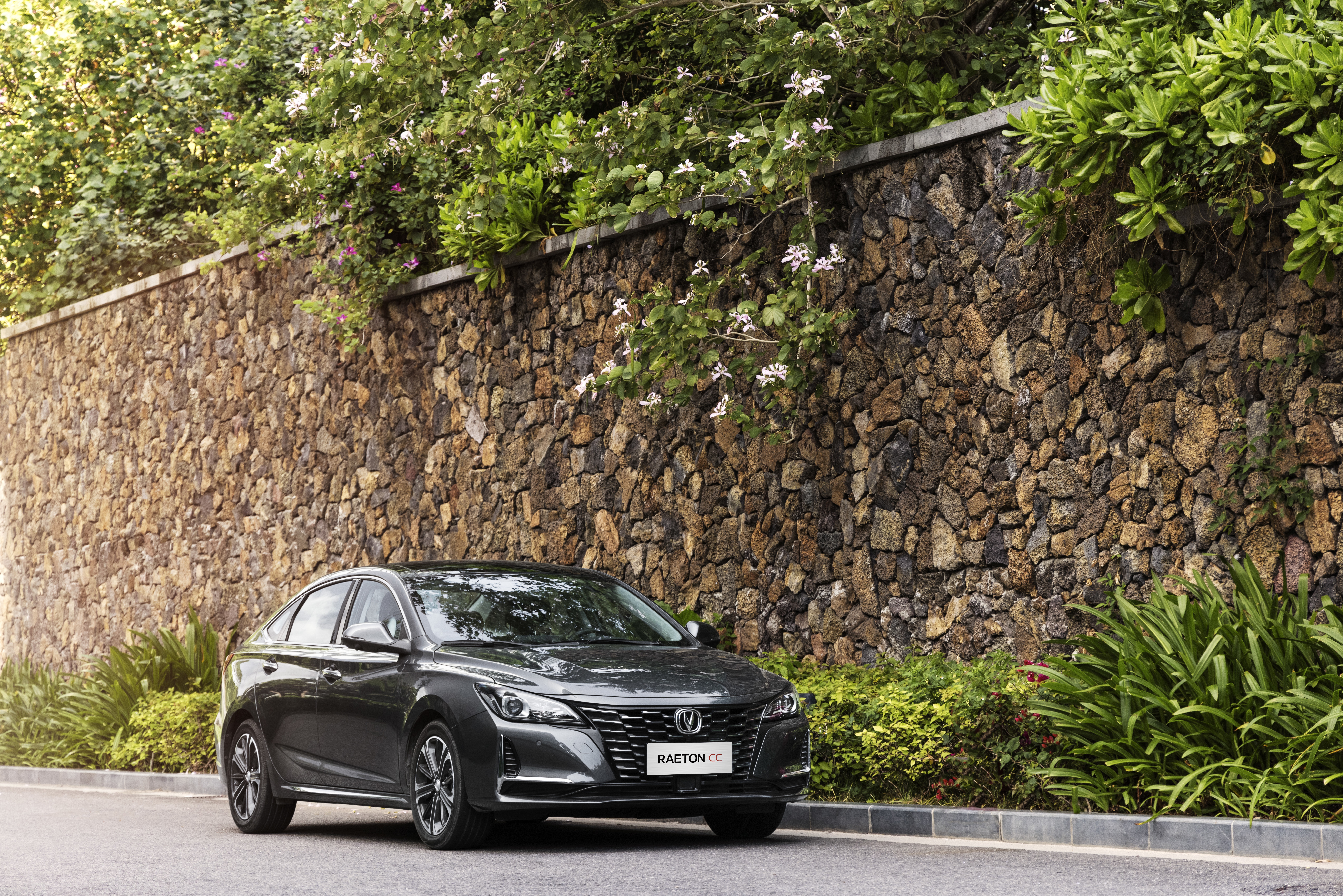 Changan Raeton CC car parked by stone wall HD Wallpaper