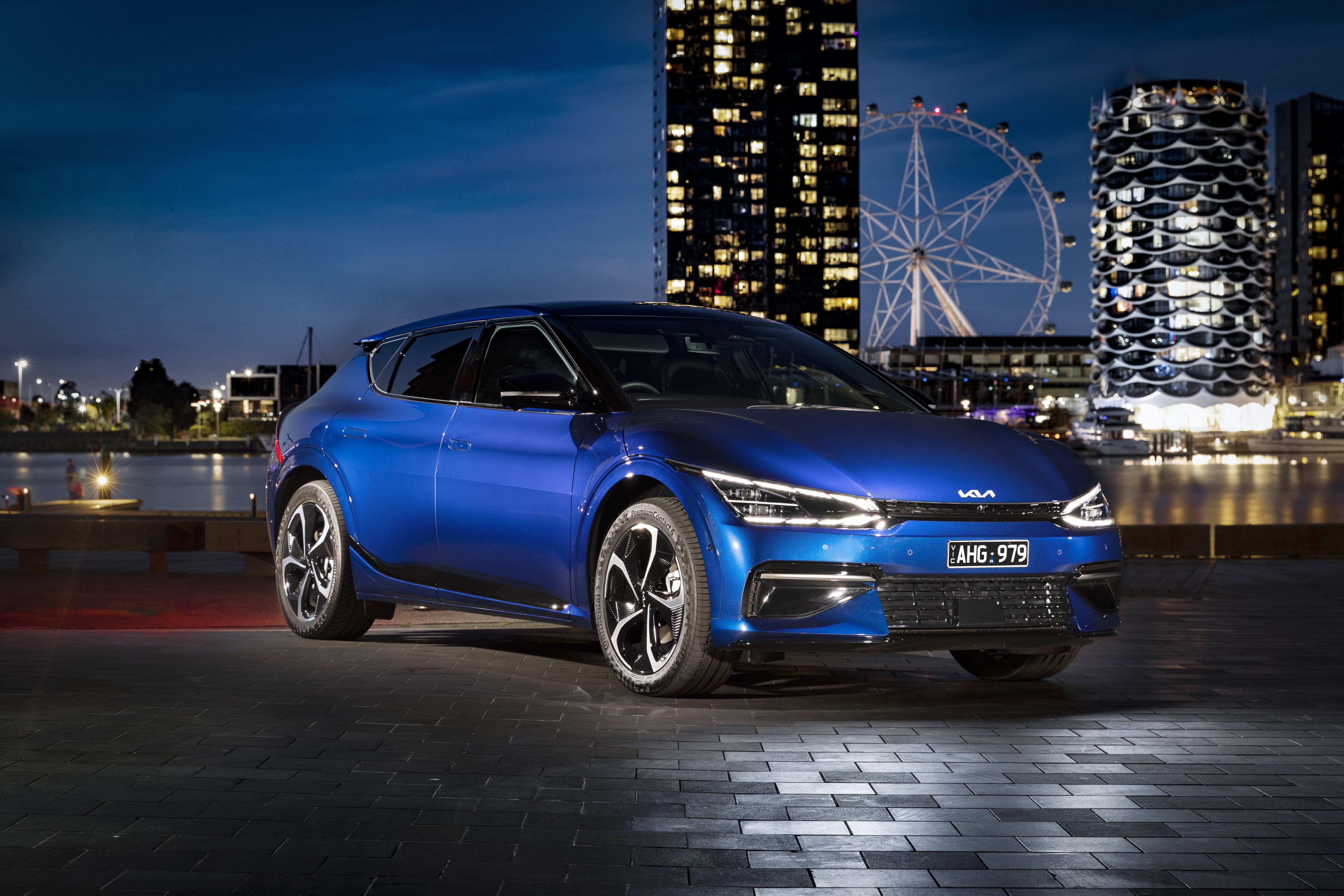 Blue Kia EV6 GT Line electric SUV at night HD Wallpaper