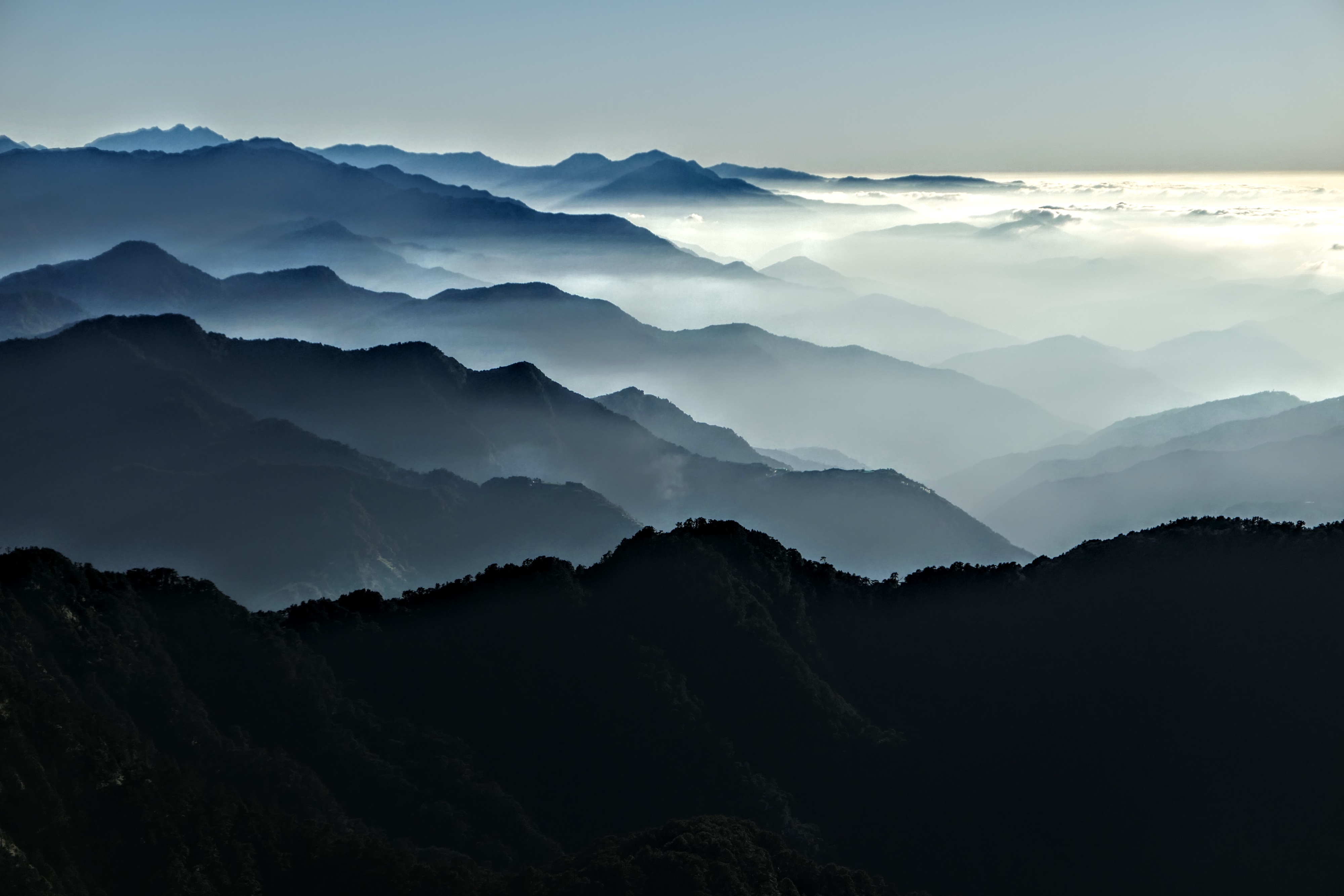 Mountain range at sunrise with clouds HD Wallpaper