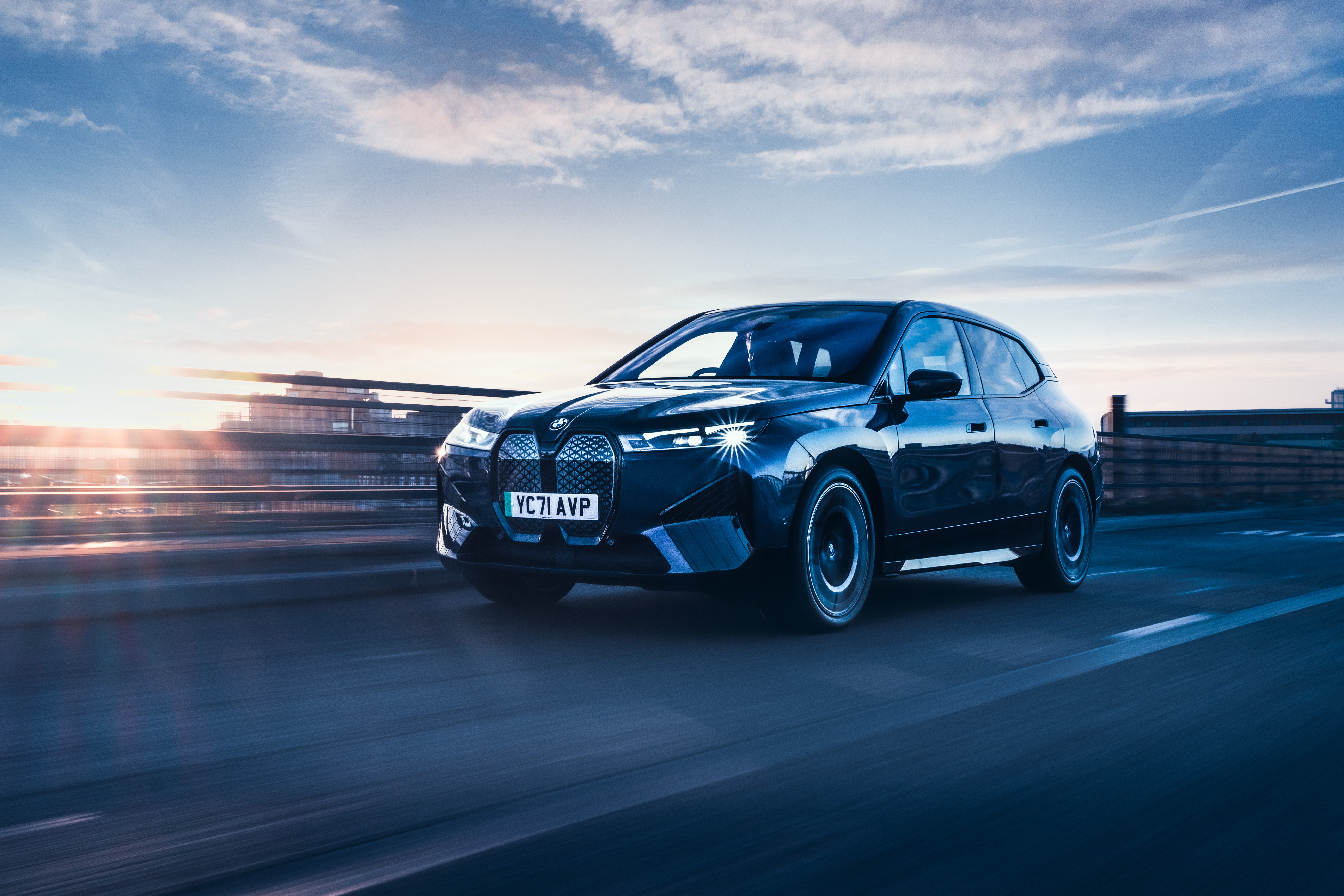 BMW iX xDrive40 Sport 4K SUV on a bridge HD Wallpaper