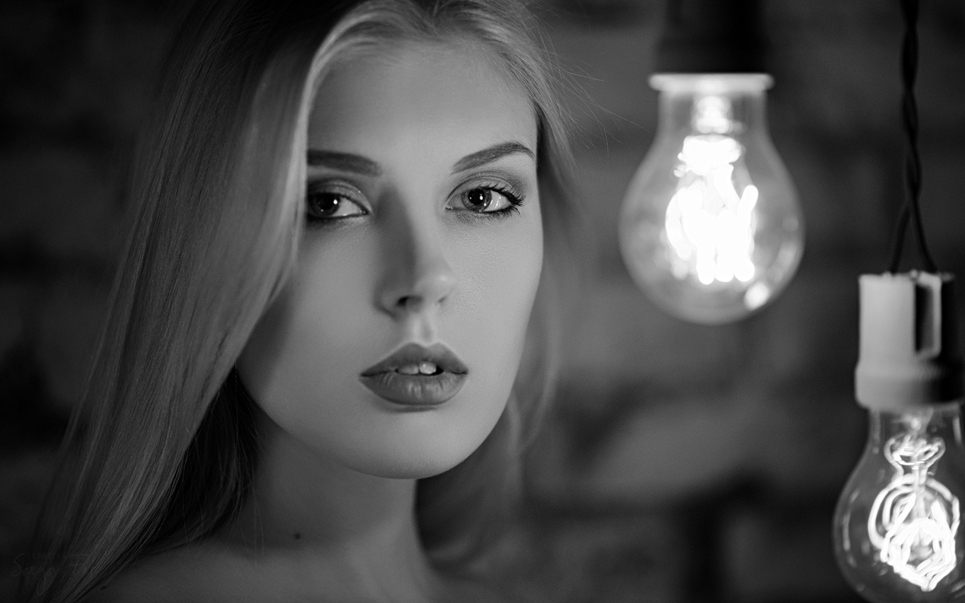 Black and White Portrait of a Woman with Light Bulbs HD Wallpaper