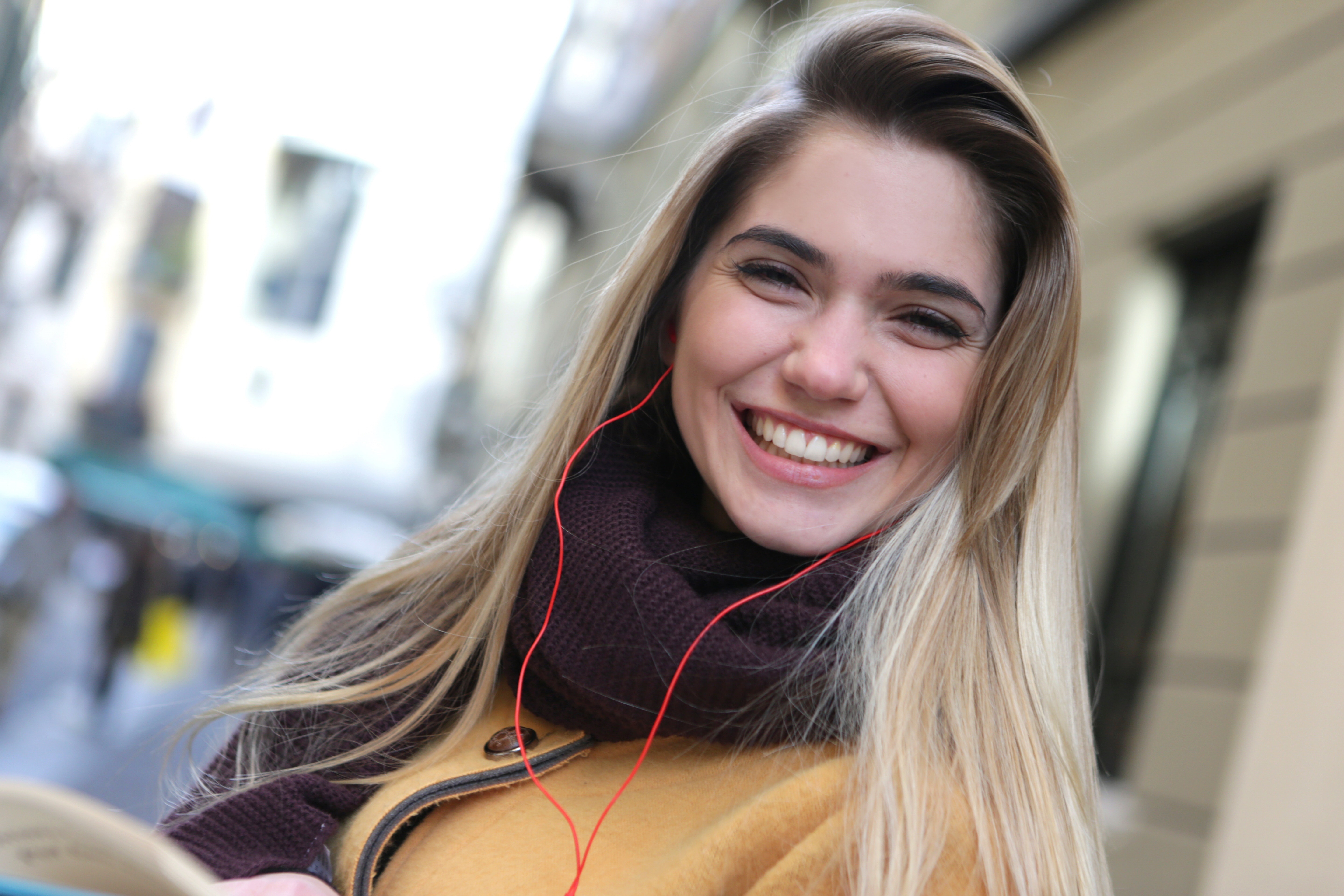 Smiling Model Wearing Scarf in 4K HD Wallpaper