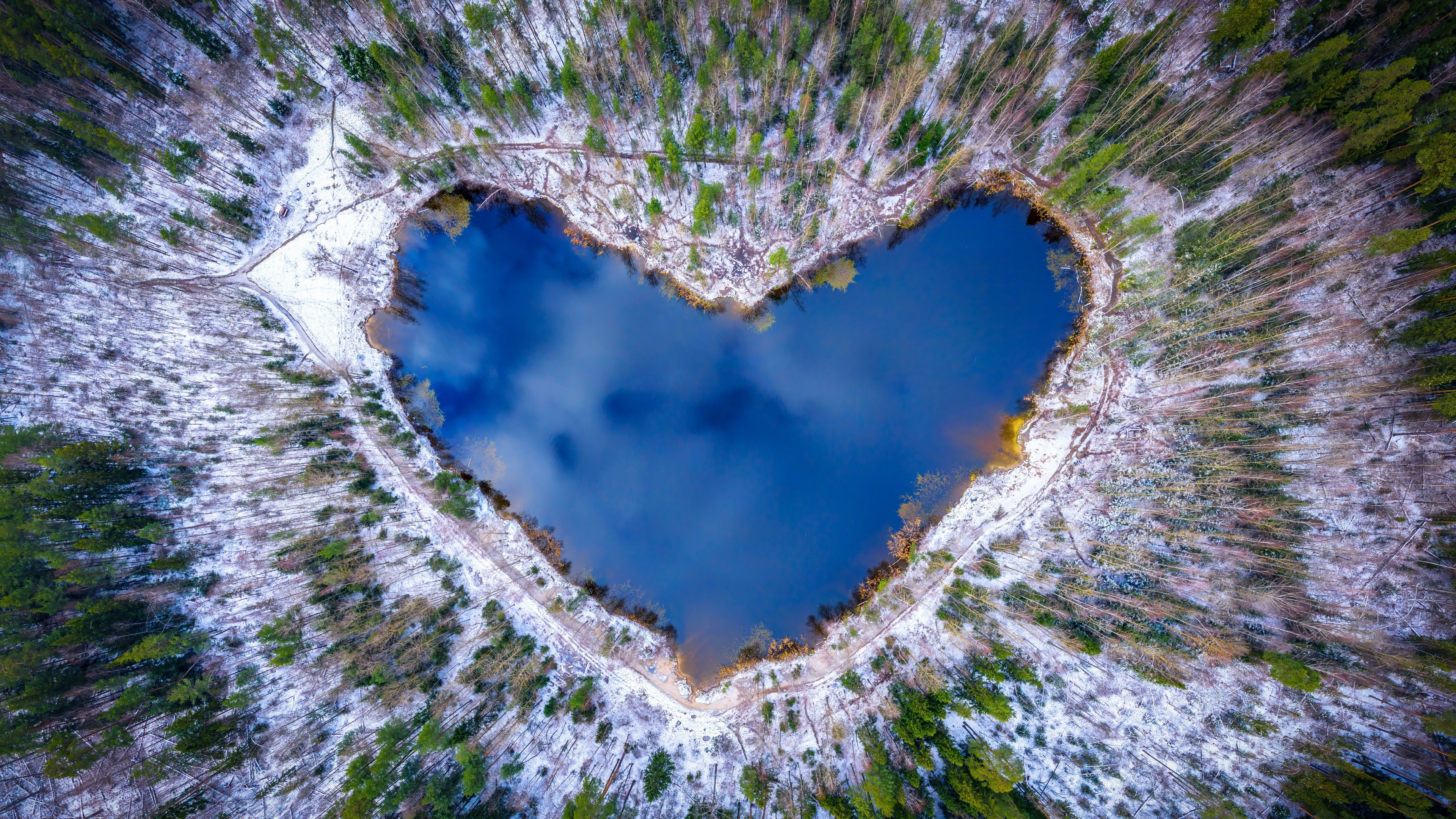 Heart-Shaped Lake in Snowy Forest HD Wallpaper