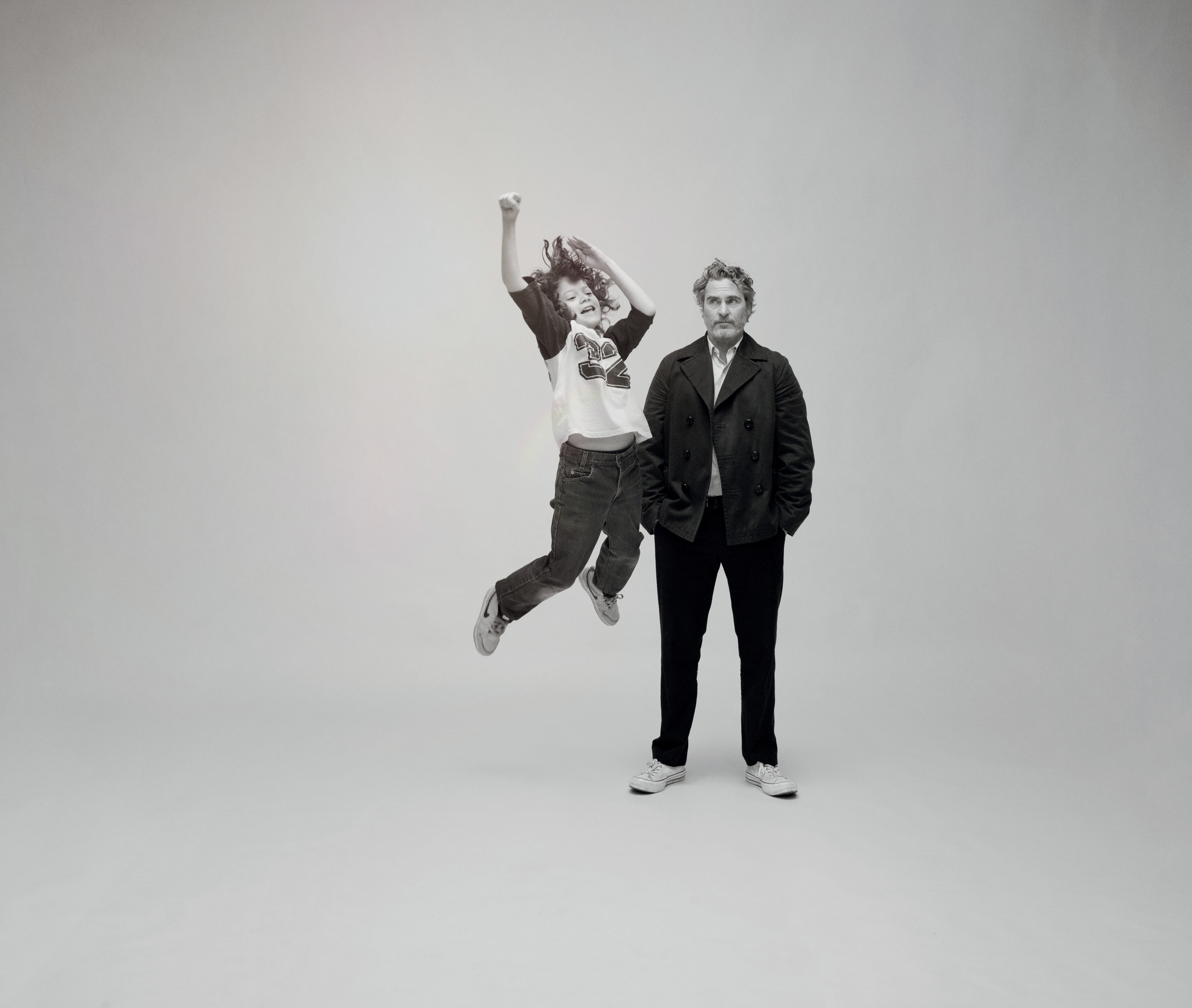 Joaquin Phoenix and a jumping child HD Wallpaper