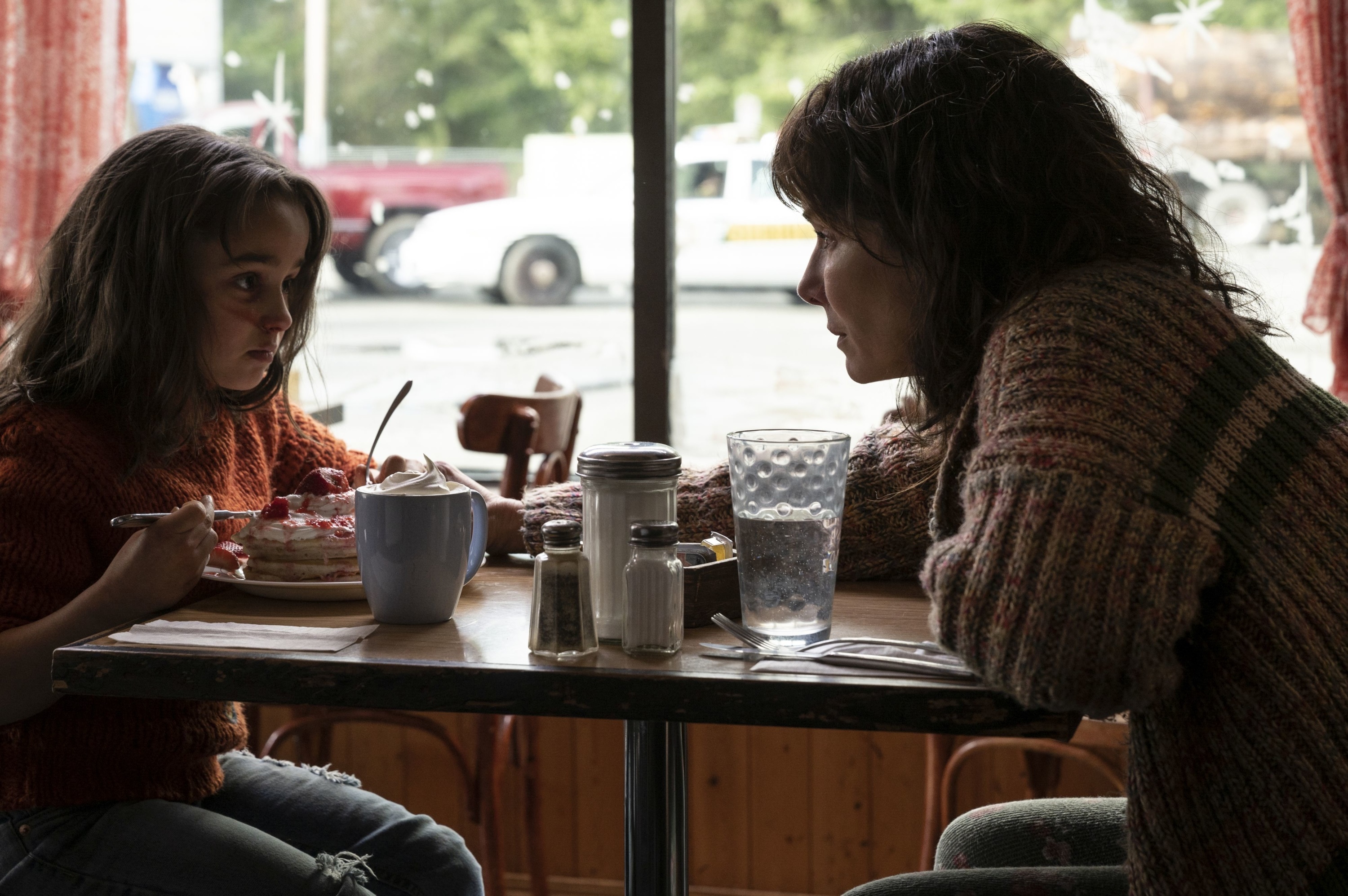 Sandra Bullock and young girl eating pancakes HD Wallpaper