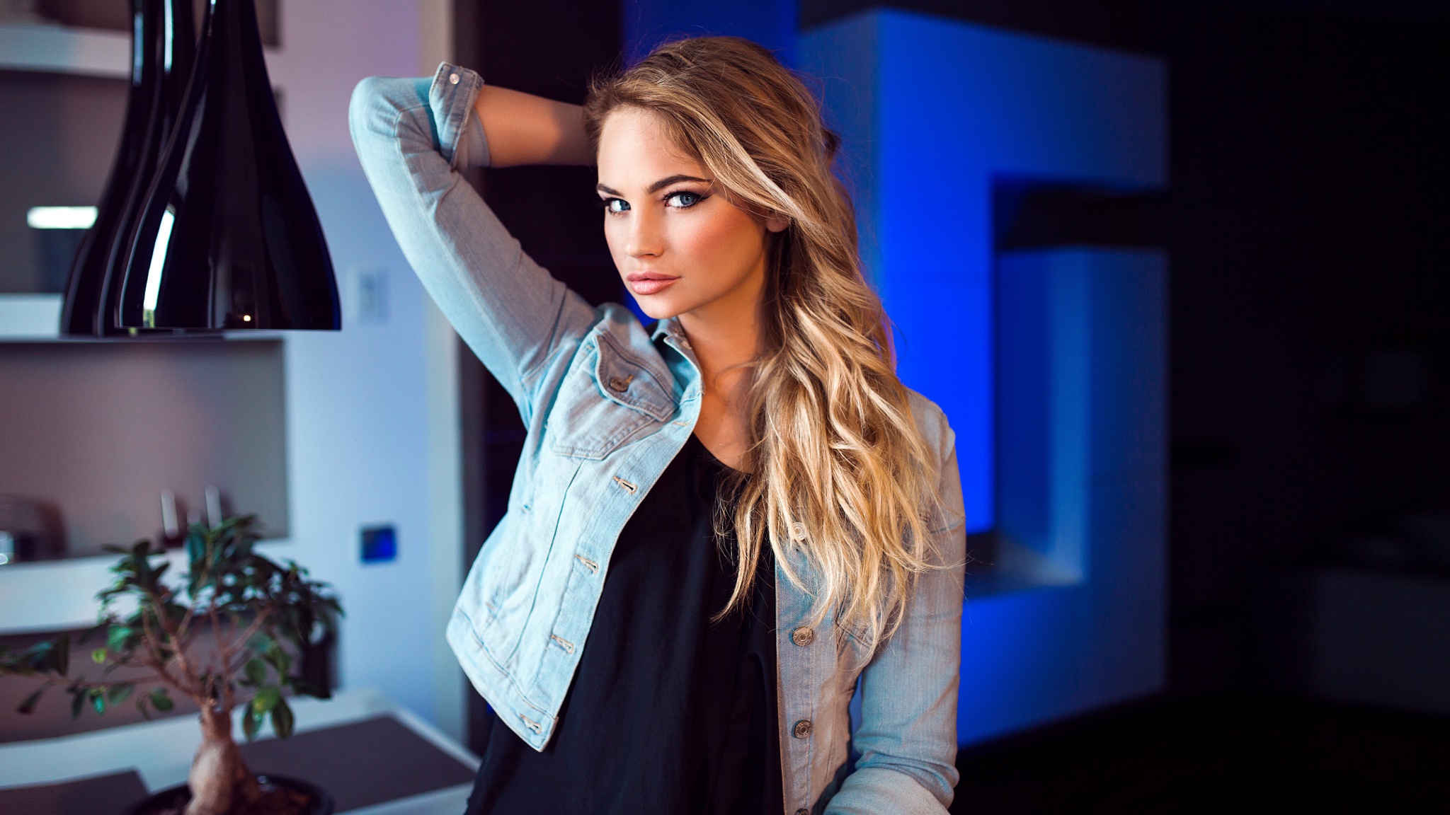 Woman in denim jacket posing indoors HD Wallpaper