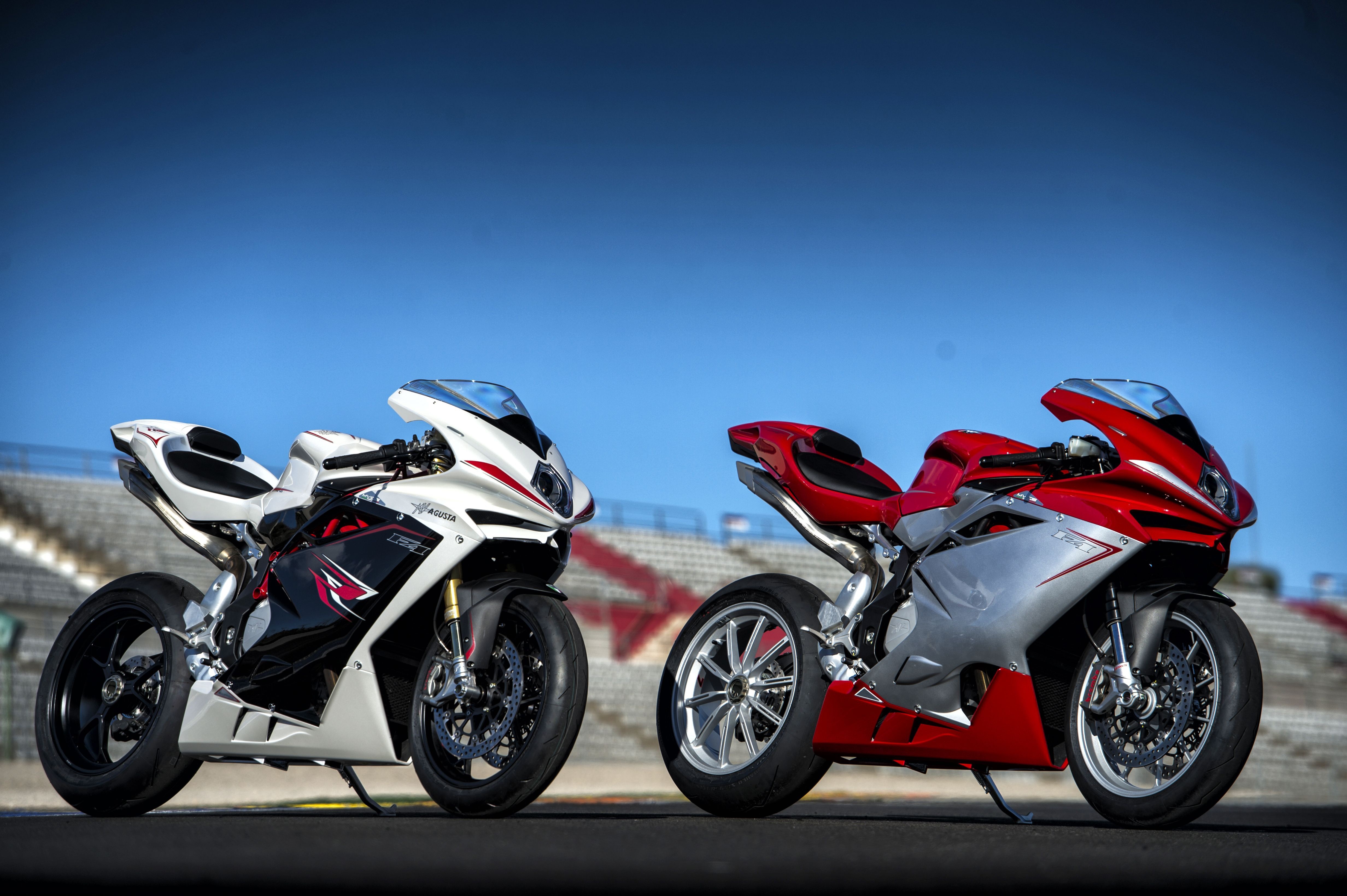 Two MV Agusta F4 motorcycles on a track HD Wallpaper