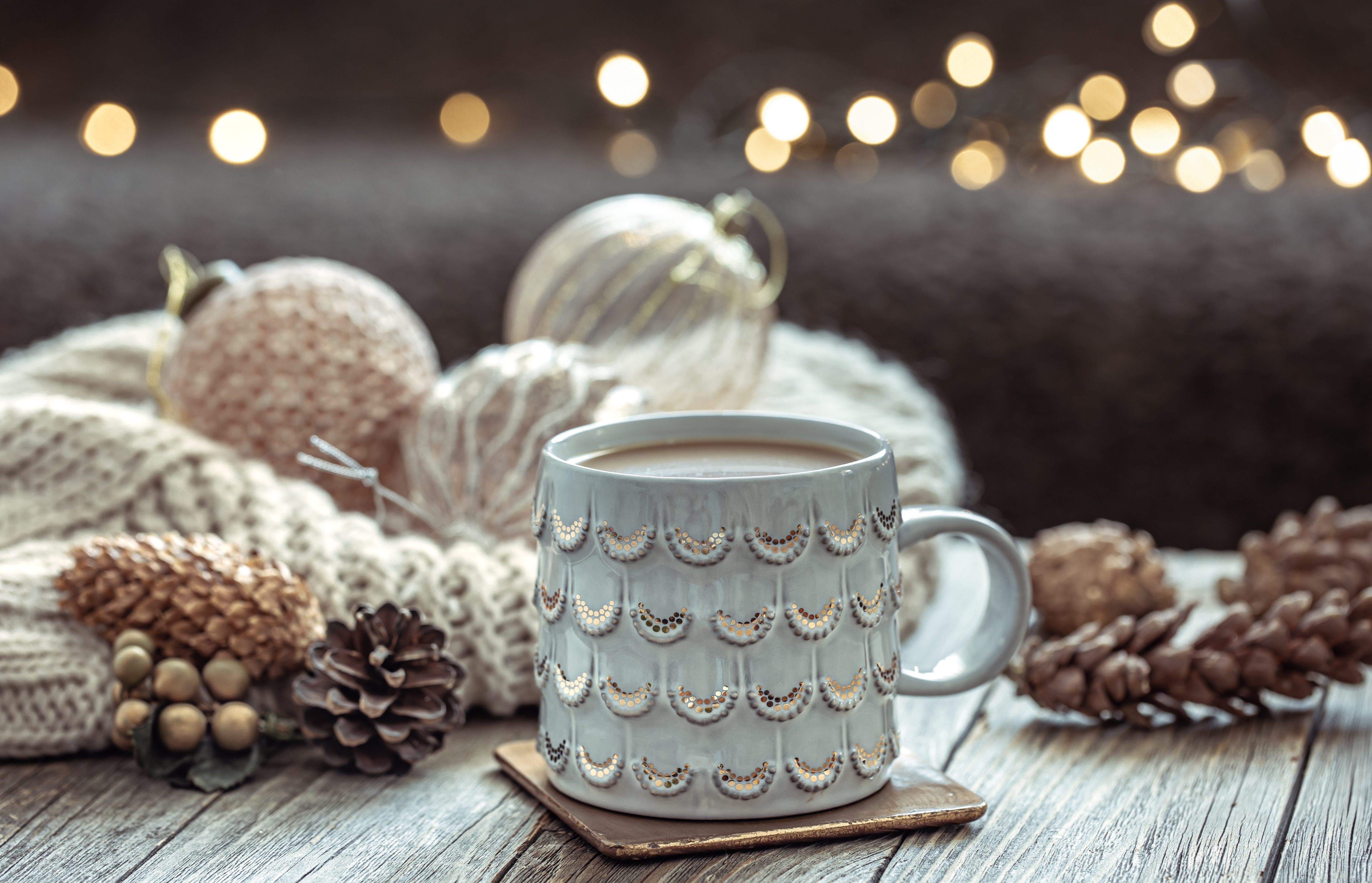 Coffee cup with Christmas ornaments and pine cones HD Wallpaper