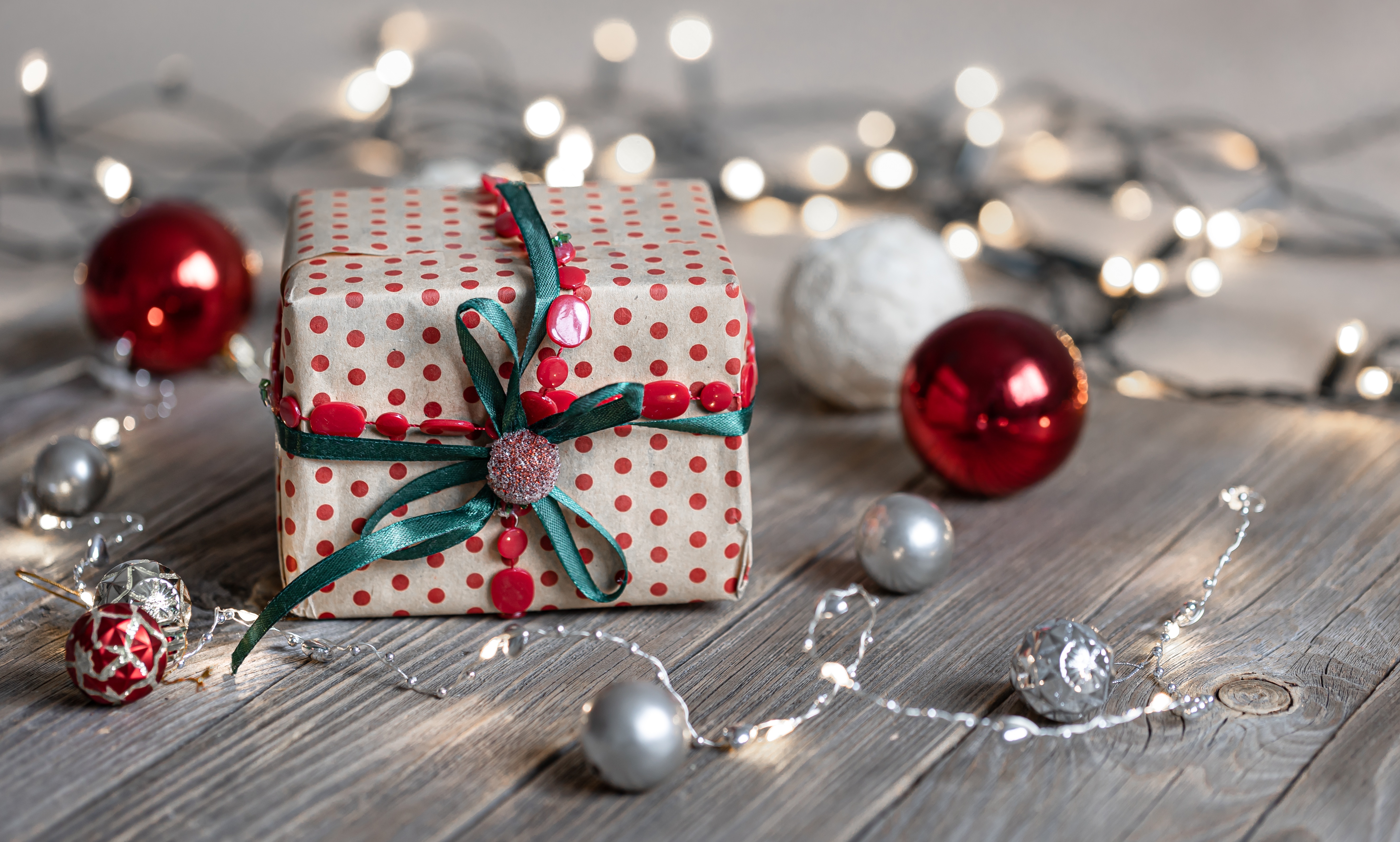 Christmas gift with ornaments and lights HD Wallpaper