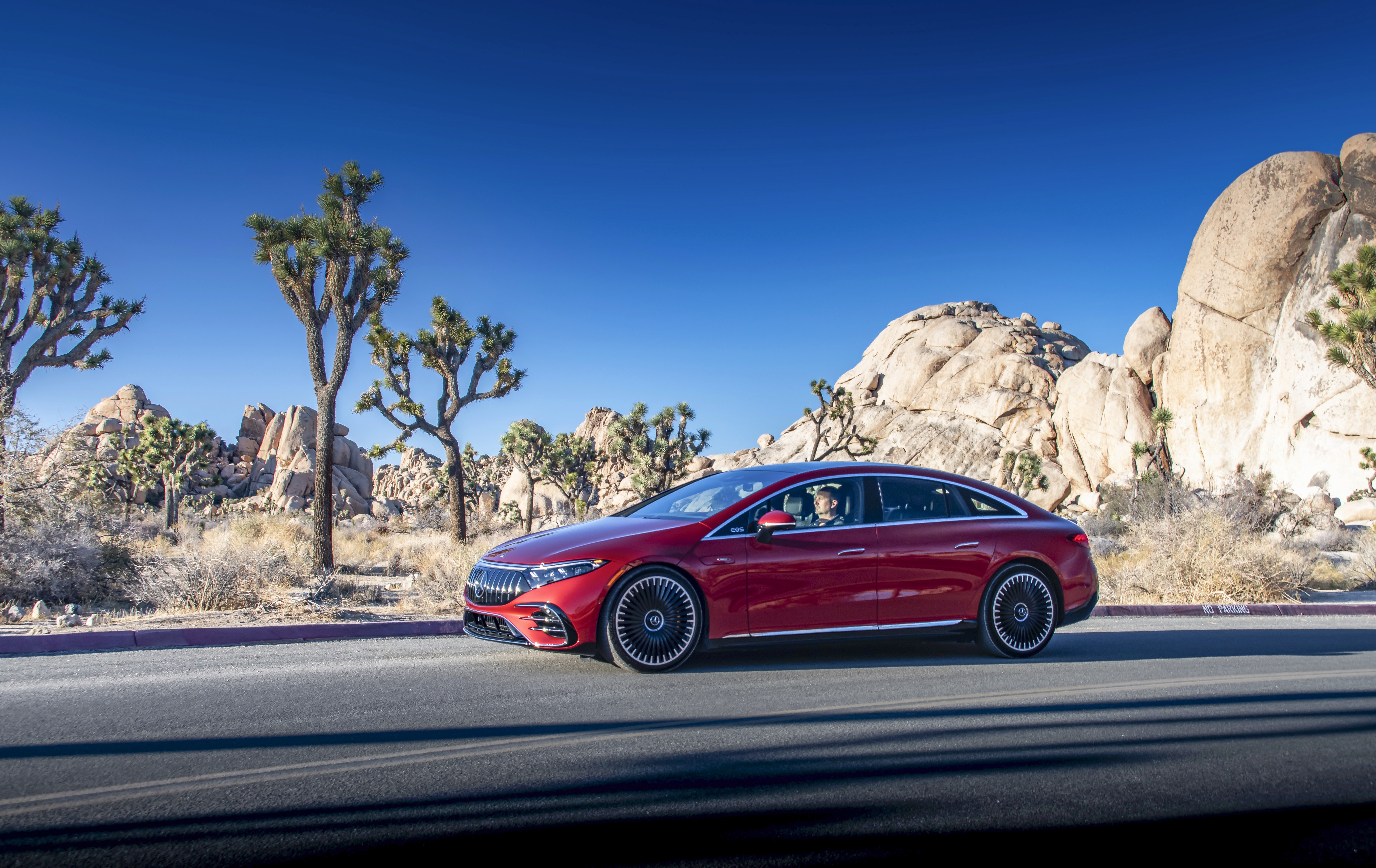 Red Mercedes-AMG EQS 53 4MATIC electric car in desert landscape HD Wallpaper