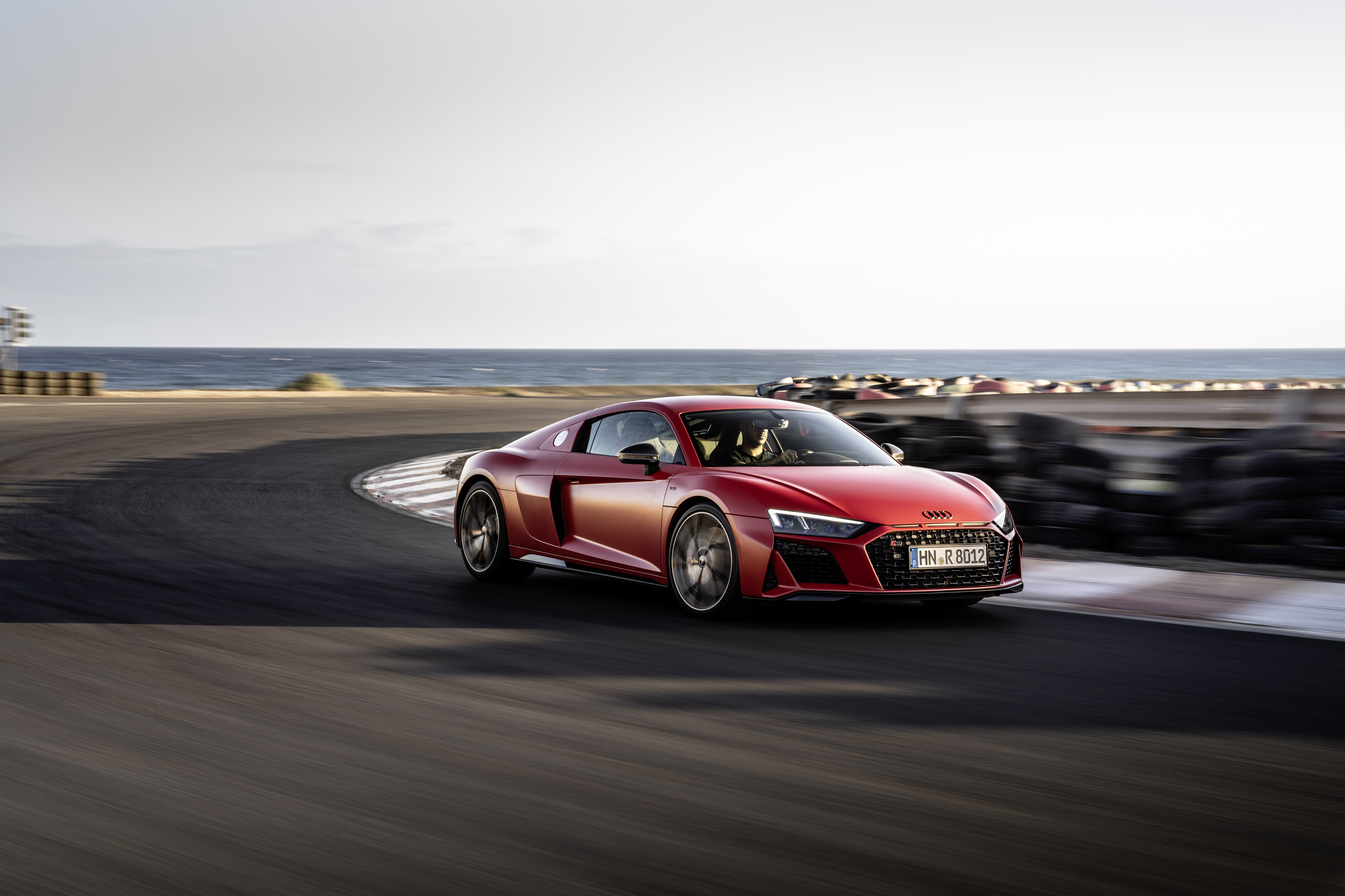 Red Audi R8 V10 on a race track HD Wallpaper