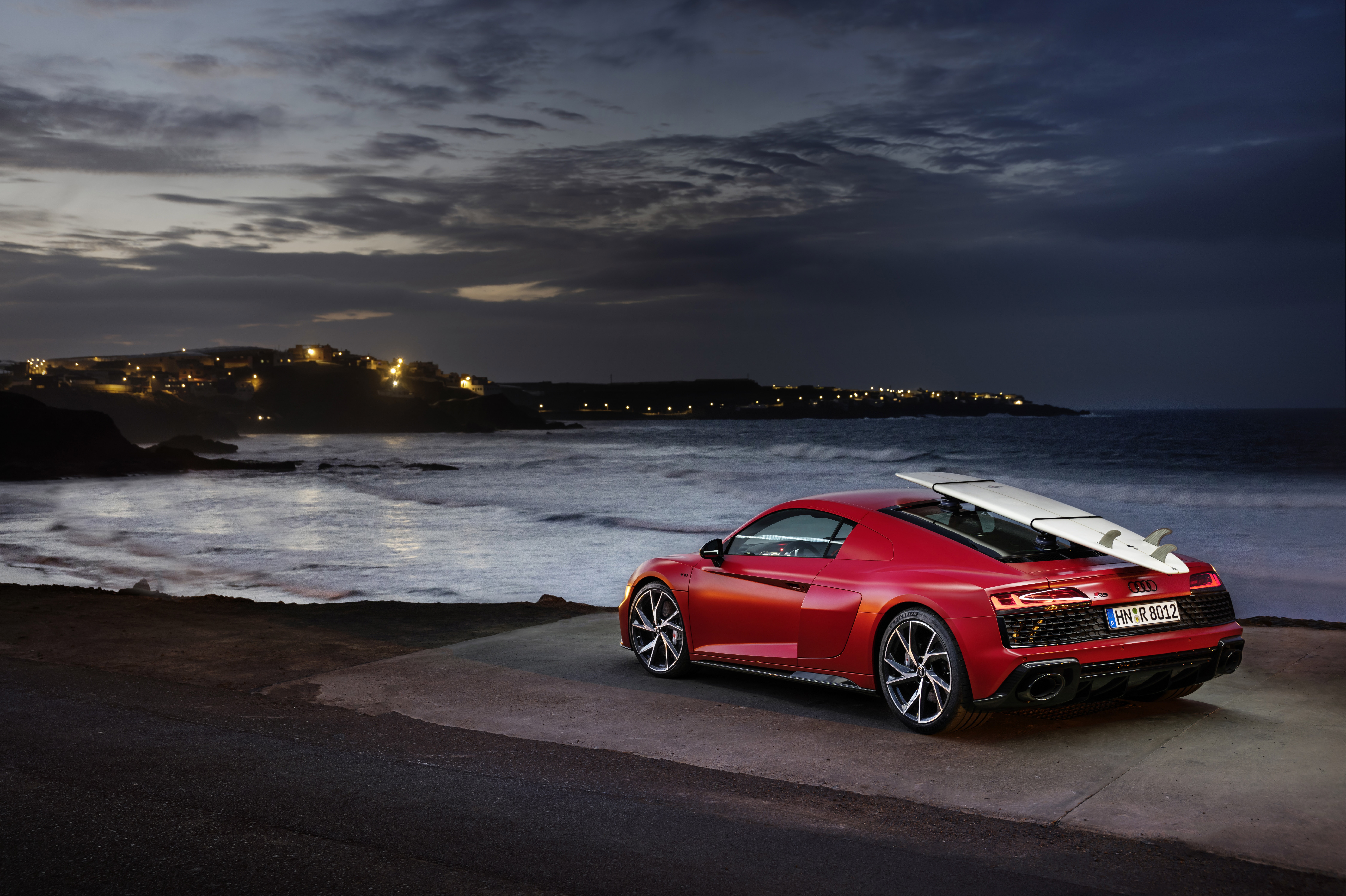 Red Audi R8 V10 with surfboard at dusk HD Wallpaper