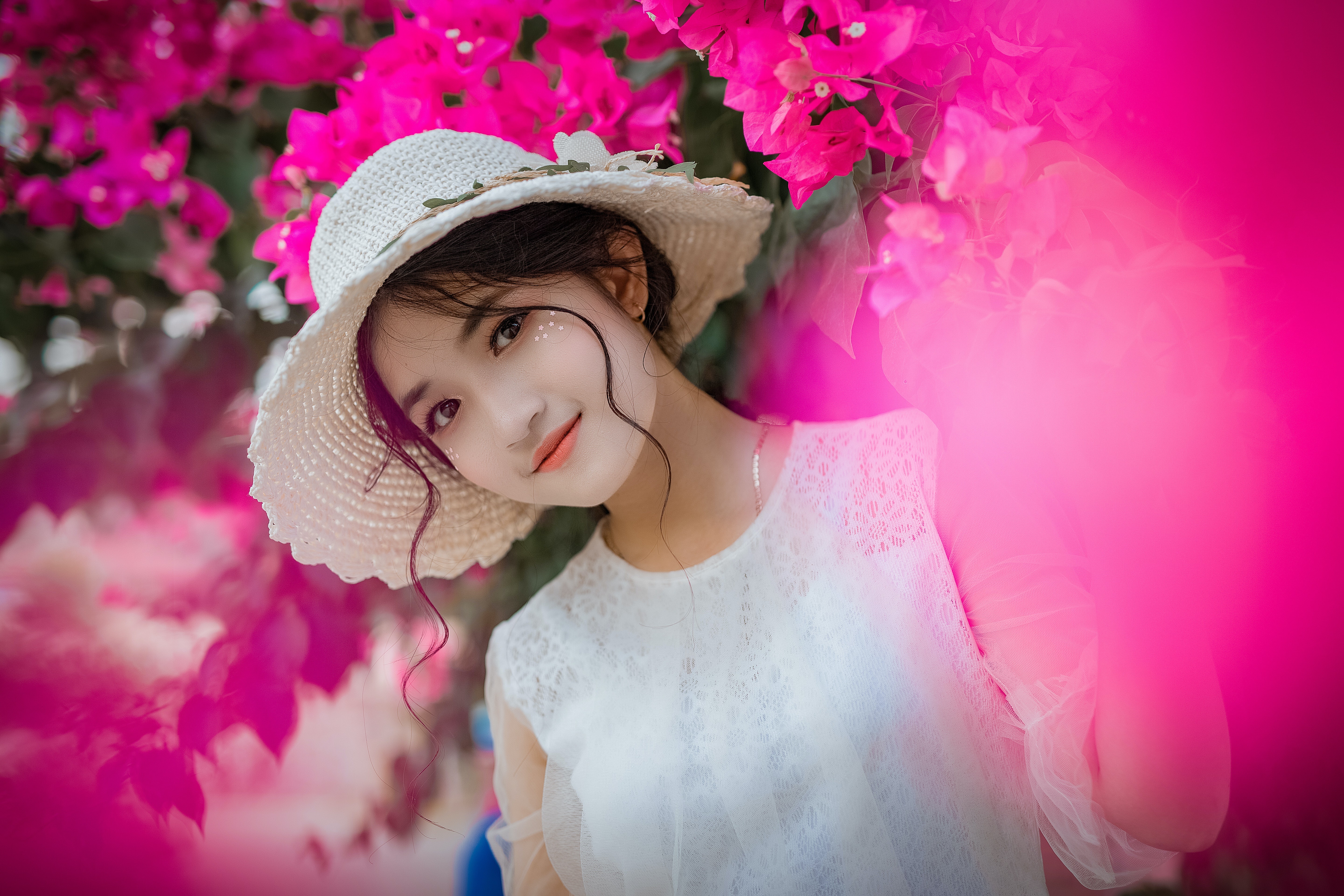 Asian girl wearing a hat with pink flowers HD Wallpaper