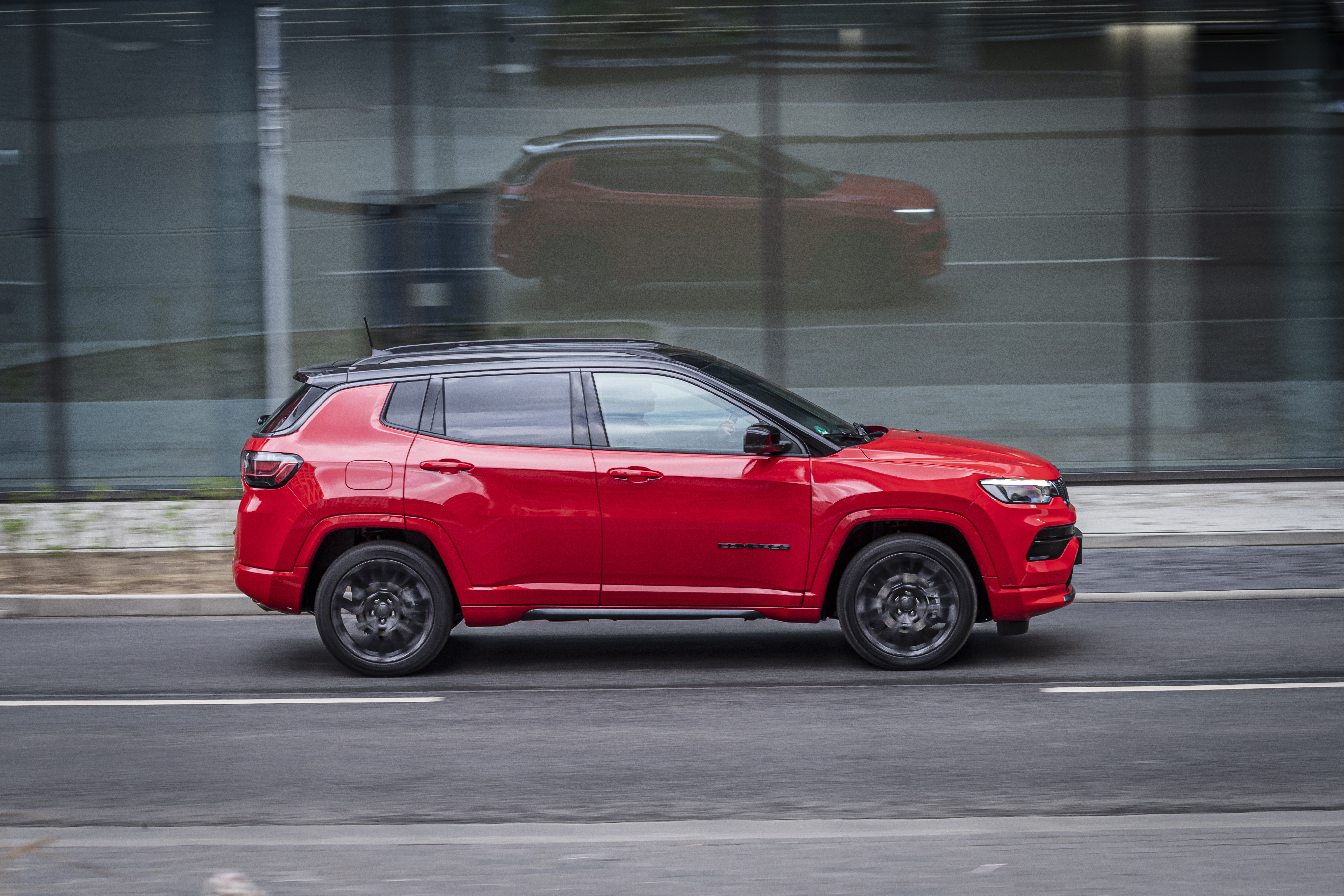 Red Jeep Compass S SUV driving on road HD Wallpaper