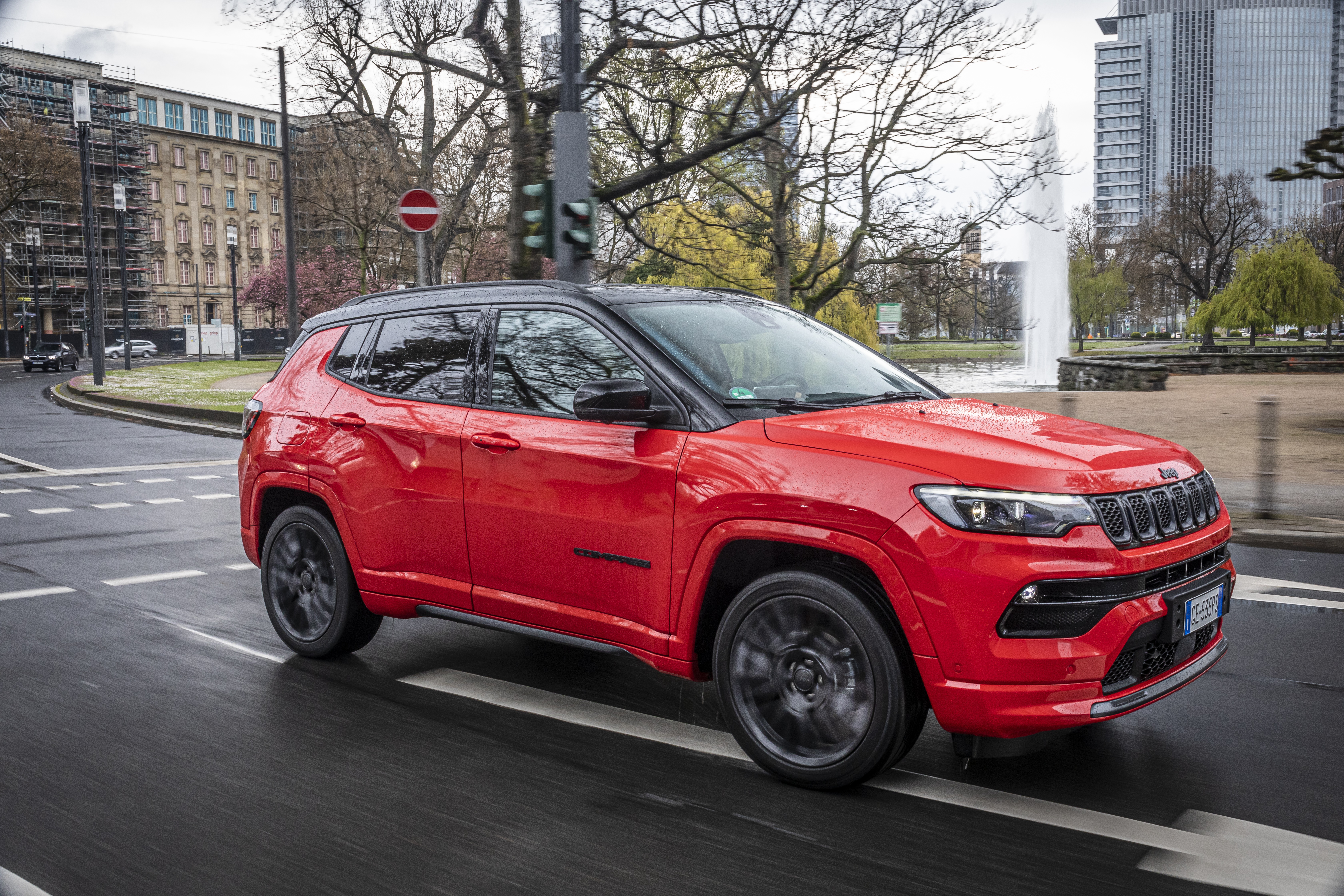 Red Jeep Compass S 4K driving on city street HD Wallpaper