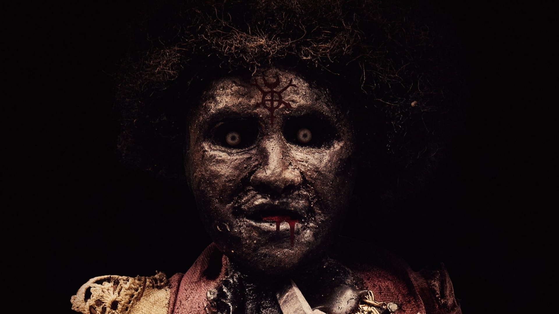 A creepy doll with a symbol on its forehead HD Wallpaper
