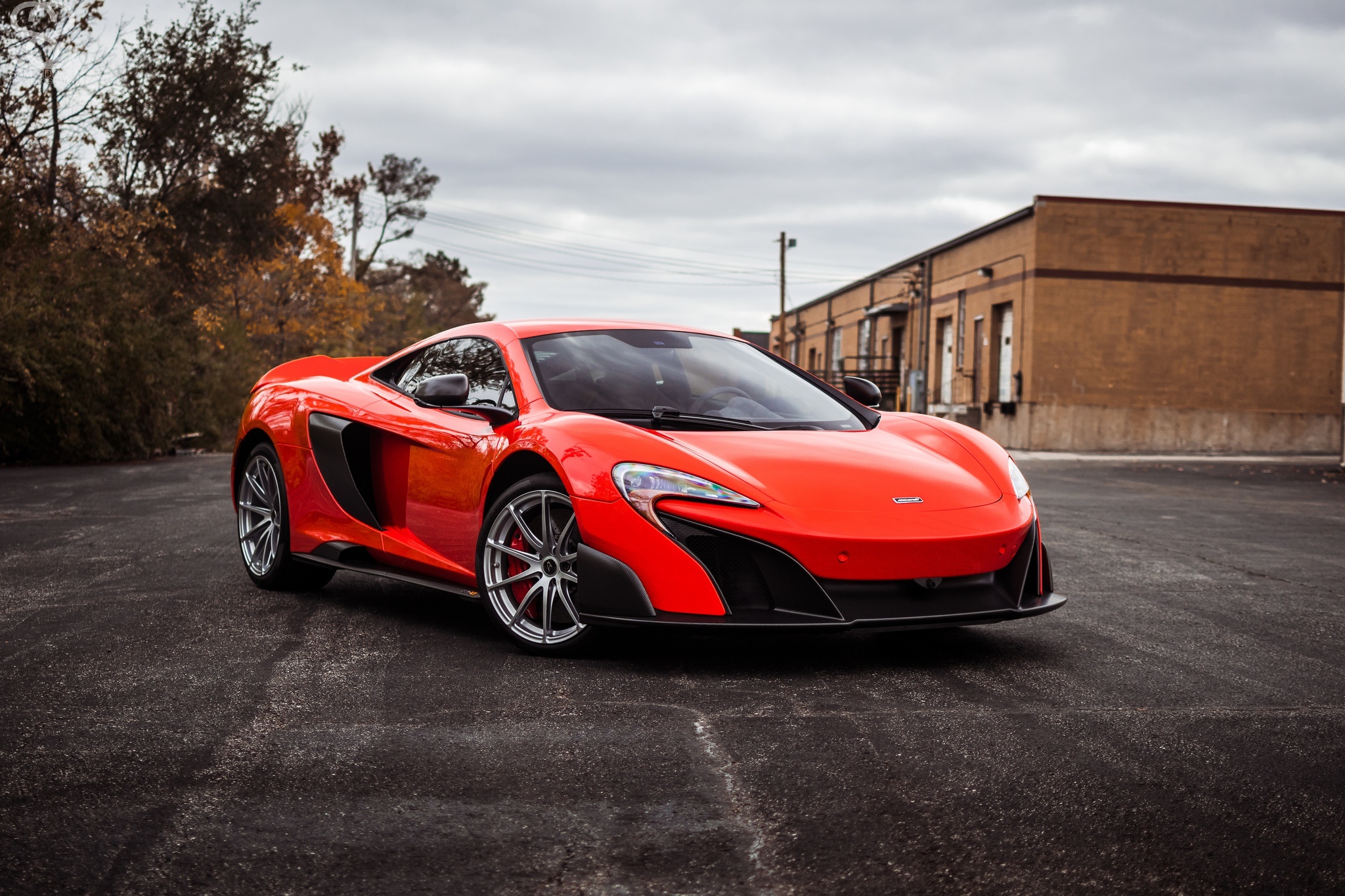 Orange McLaren 675LT Supercar parked on asphalt HD Wallpaper