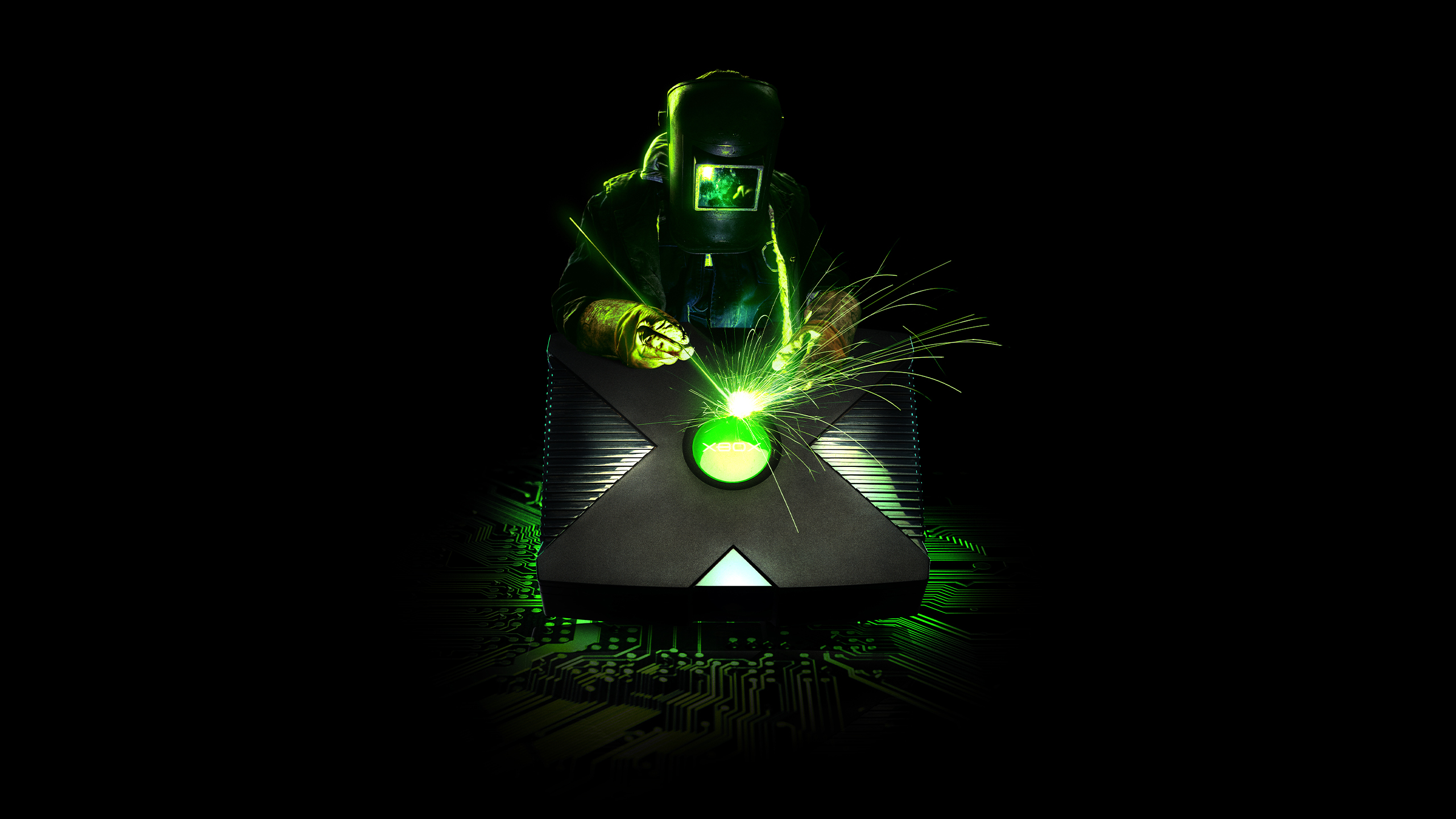 Welder working on an Xbox console HD Wallpaper