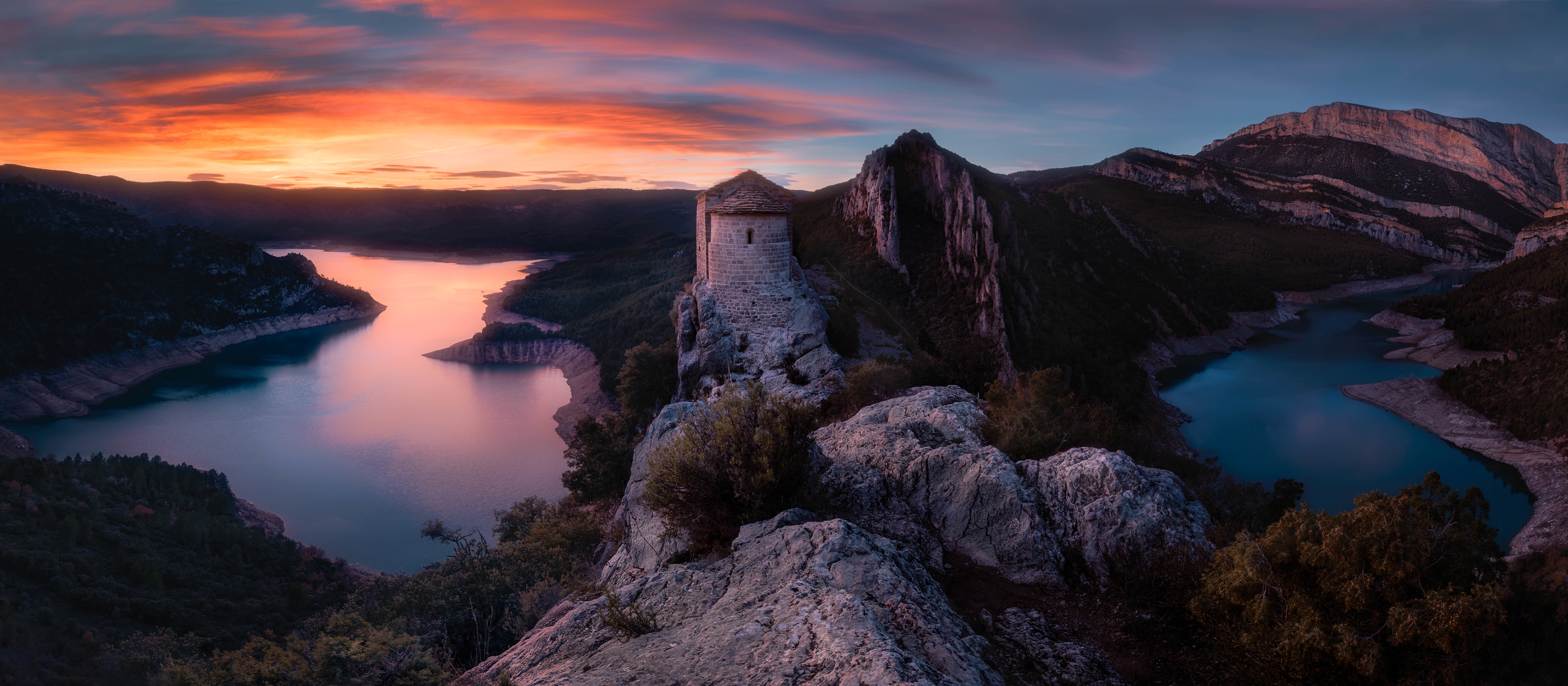 La Pertusa castle overlooking a reservoir at sunset, Spain HD Wallpaper