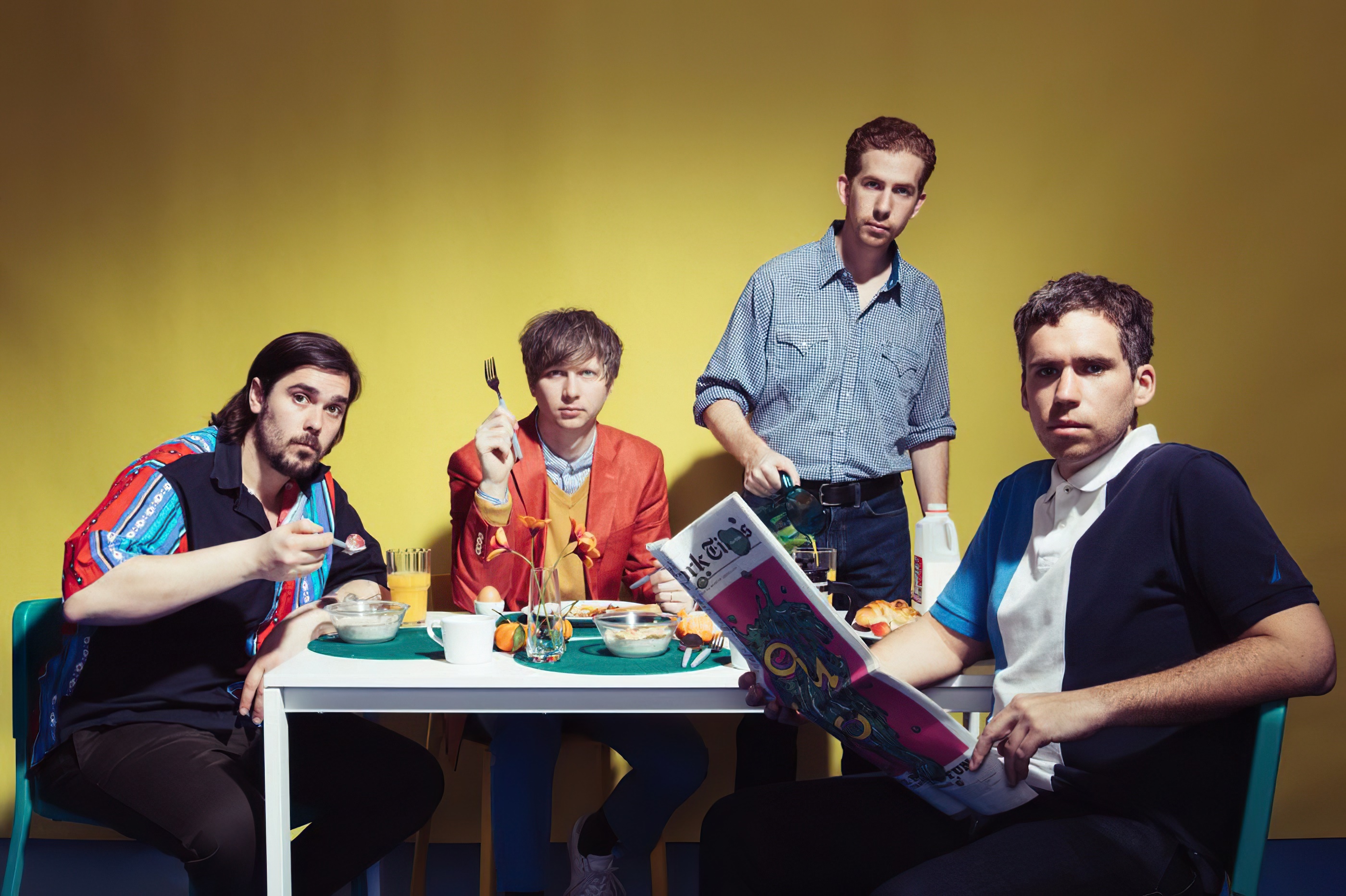 Parquet Courts band members at a breakfast table HD Wallpaper