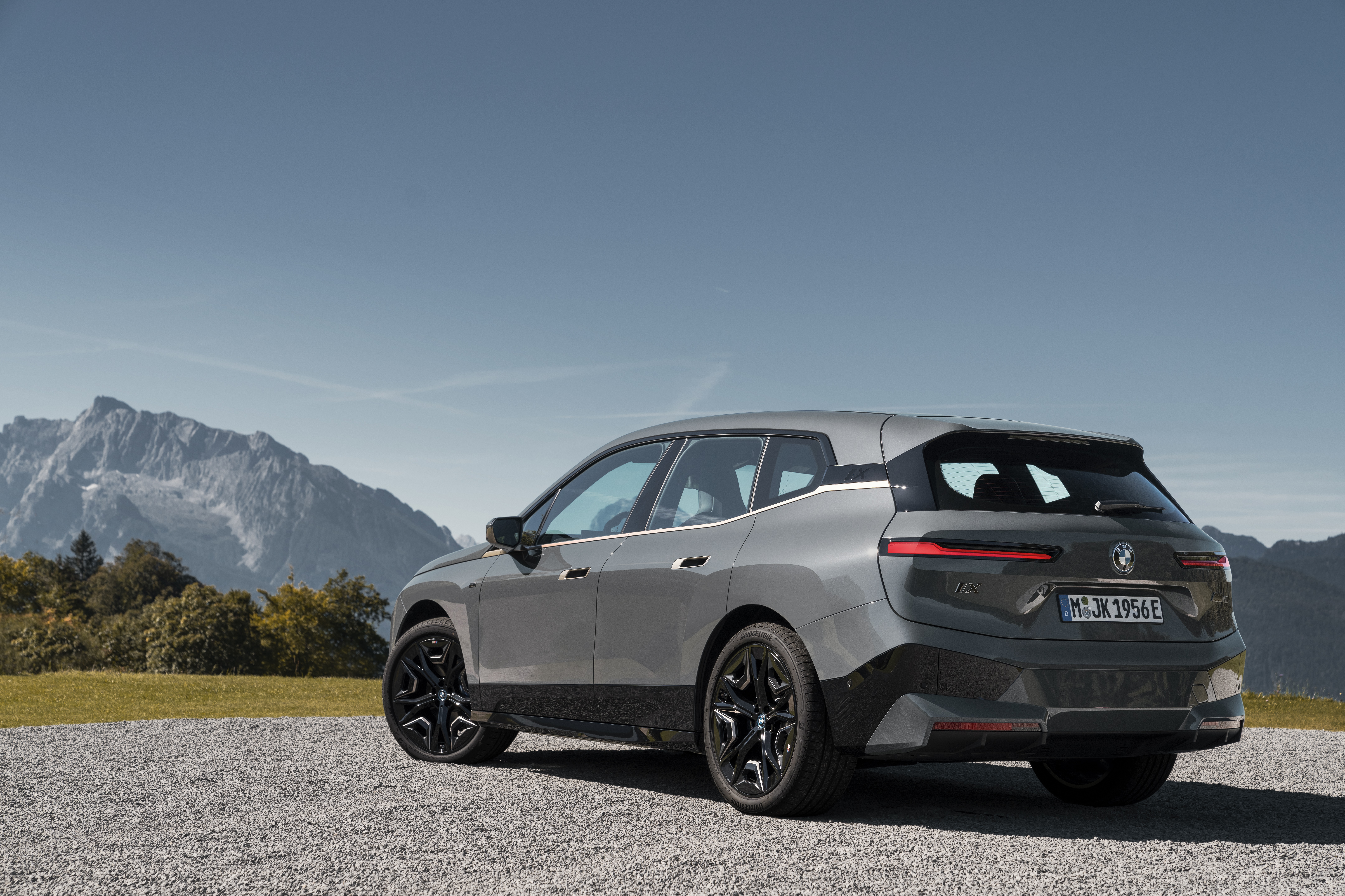 BMW iX M60 electric SUV in mountains HD Wallpaper
