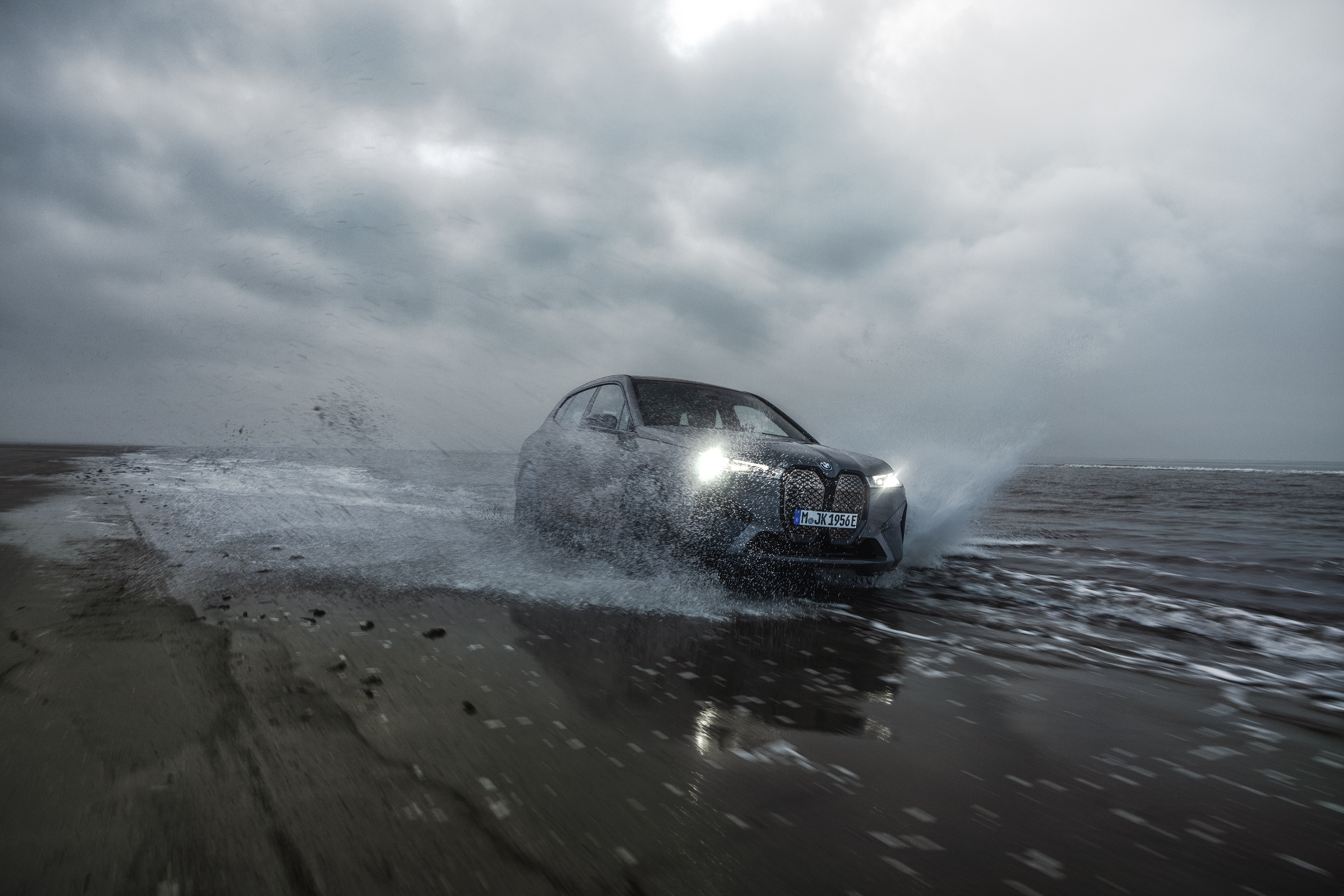 BMW iX M60 driving through water HD Wallpaper