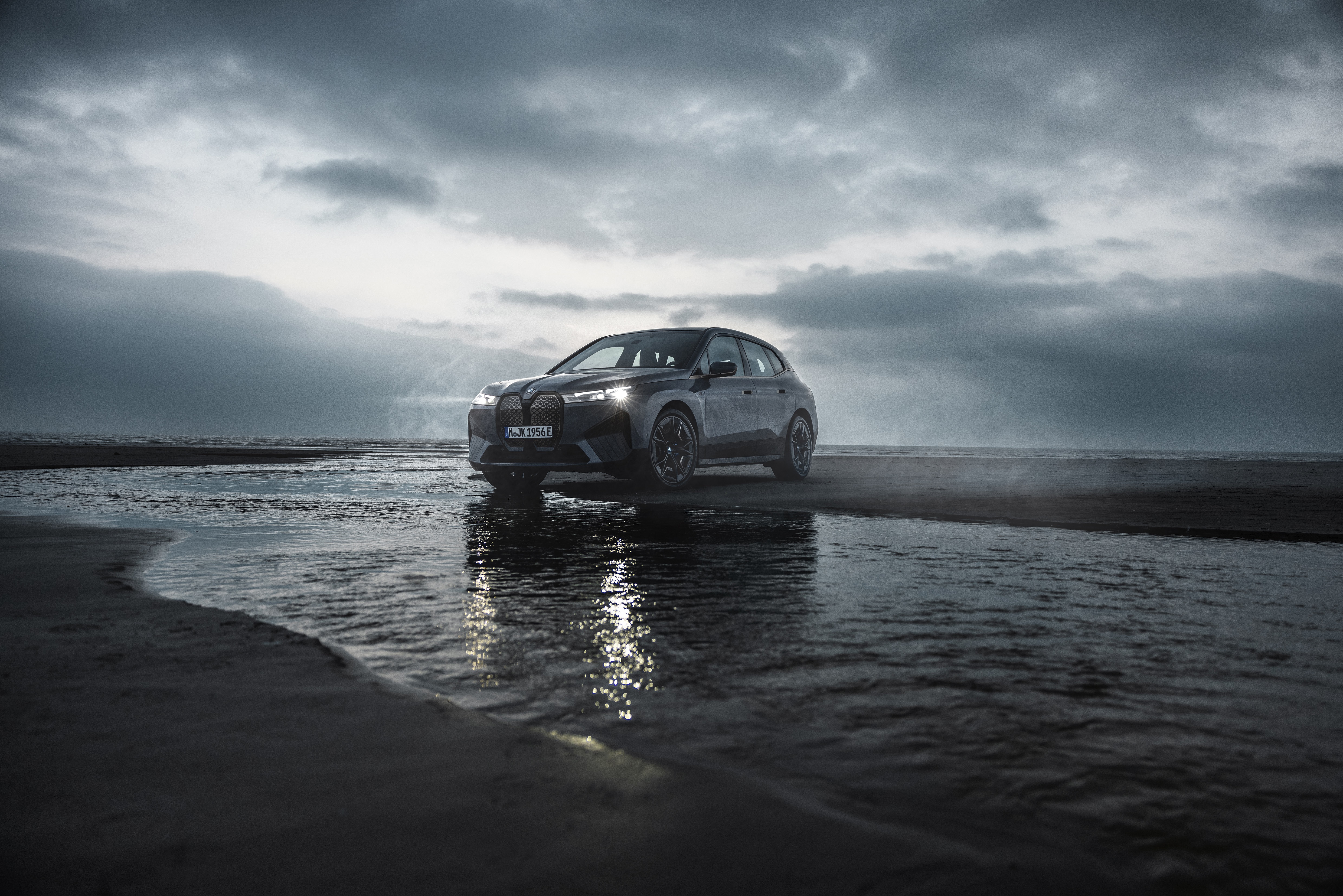 BMW iX M60 Electric SUV on a Beach HD Wallpaper