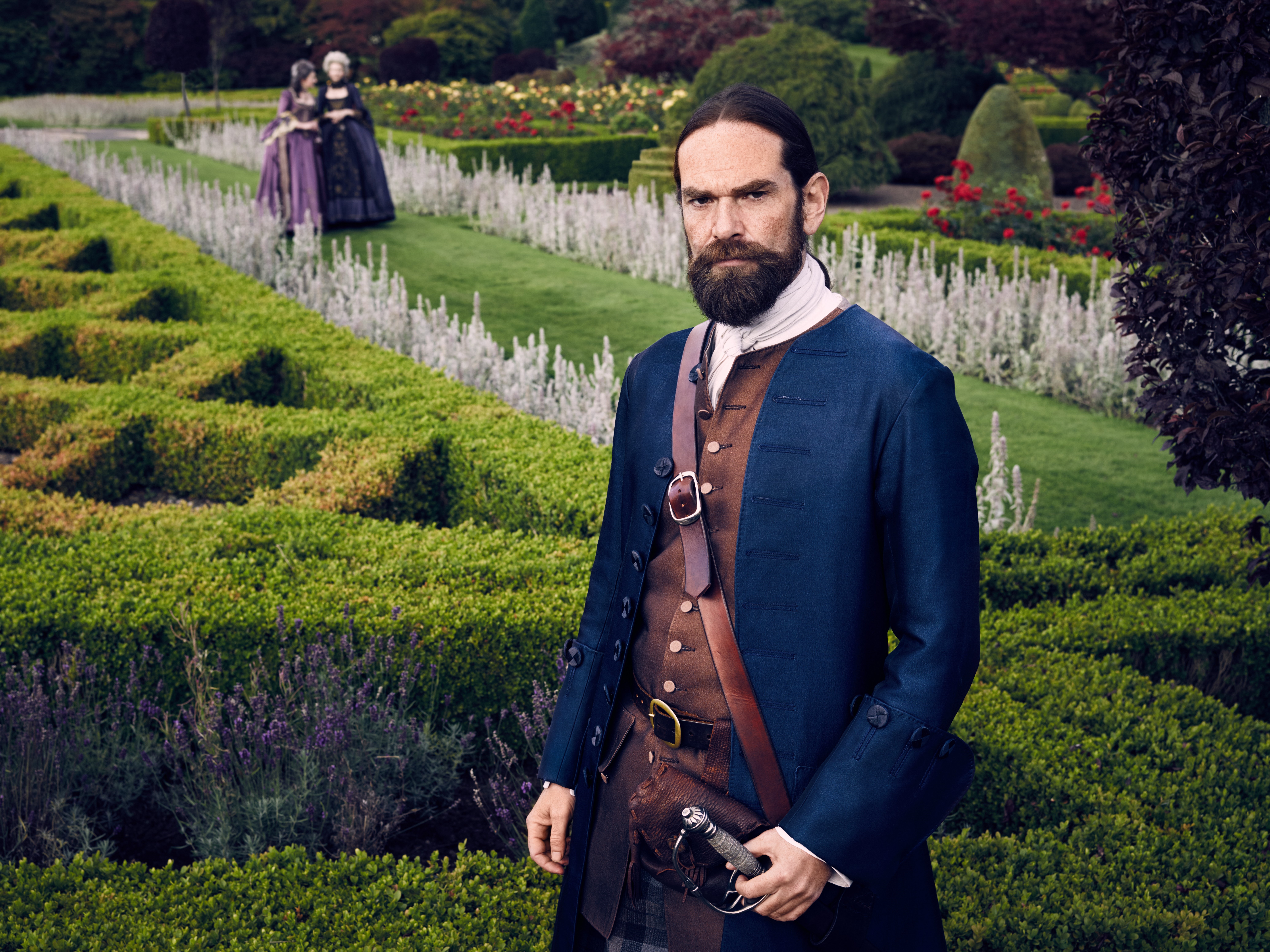 Outlander: Lord John Grey in a garden HD Wallpaper