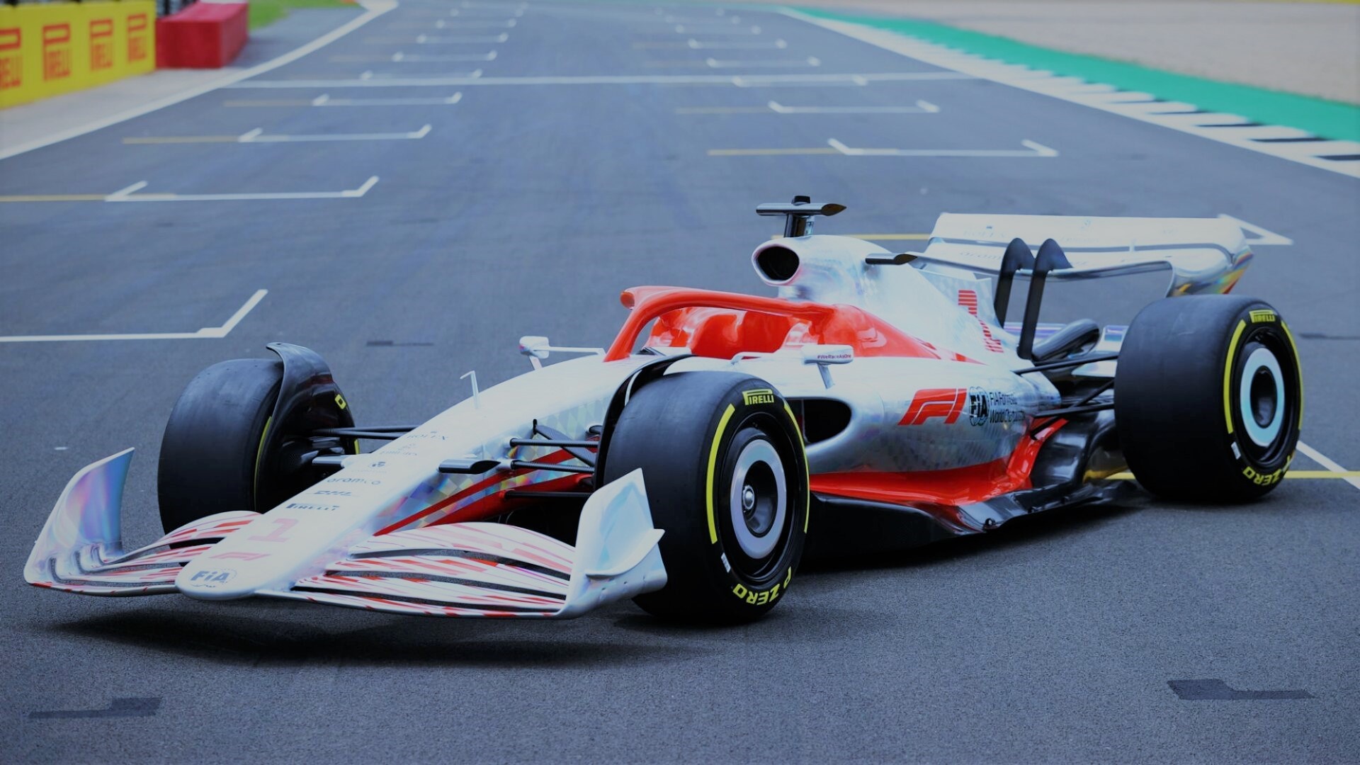 Formula 1 car on a race track HD Wallpaper