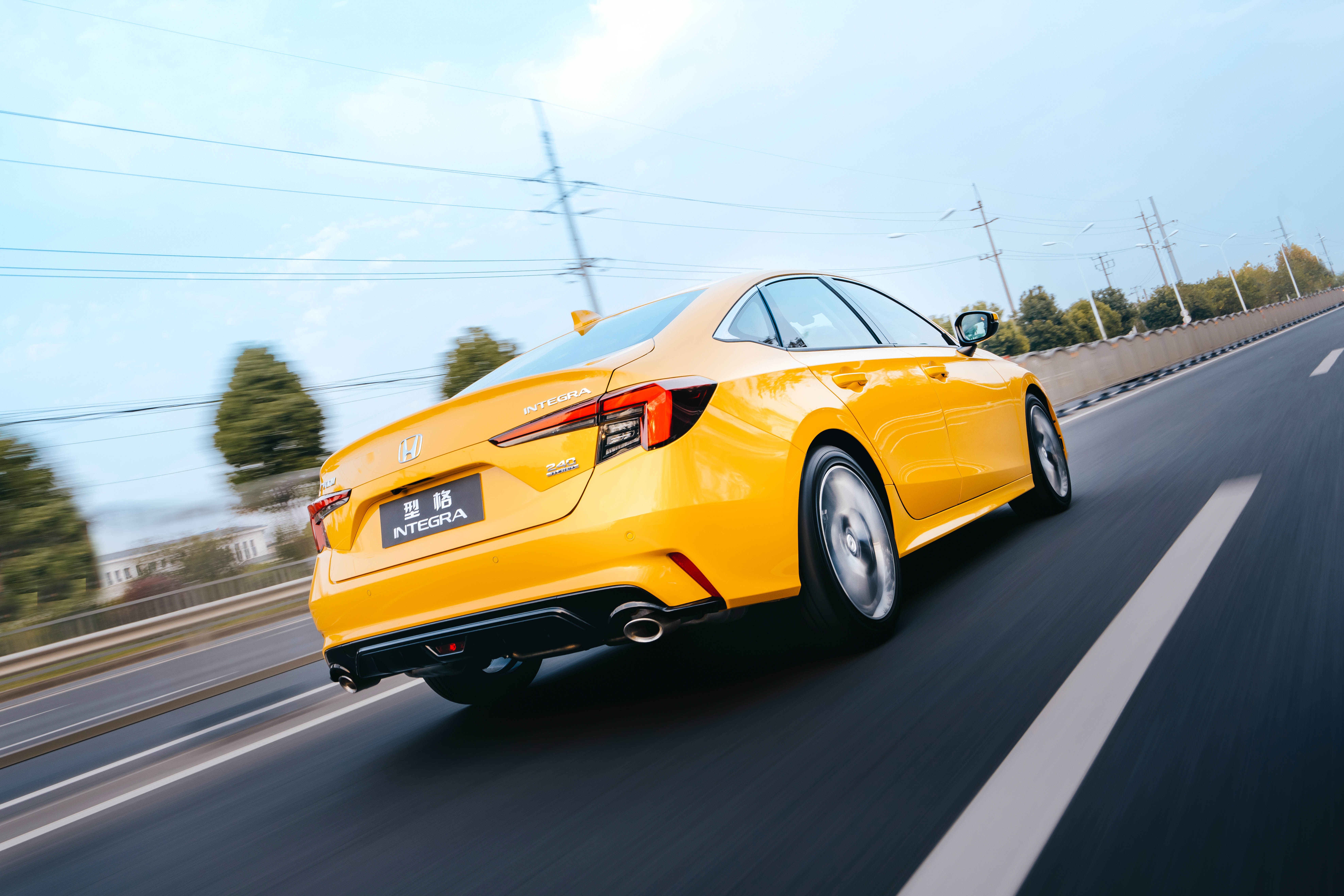Yellow Honda Integra driving on a highway HD Wallpaper
