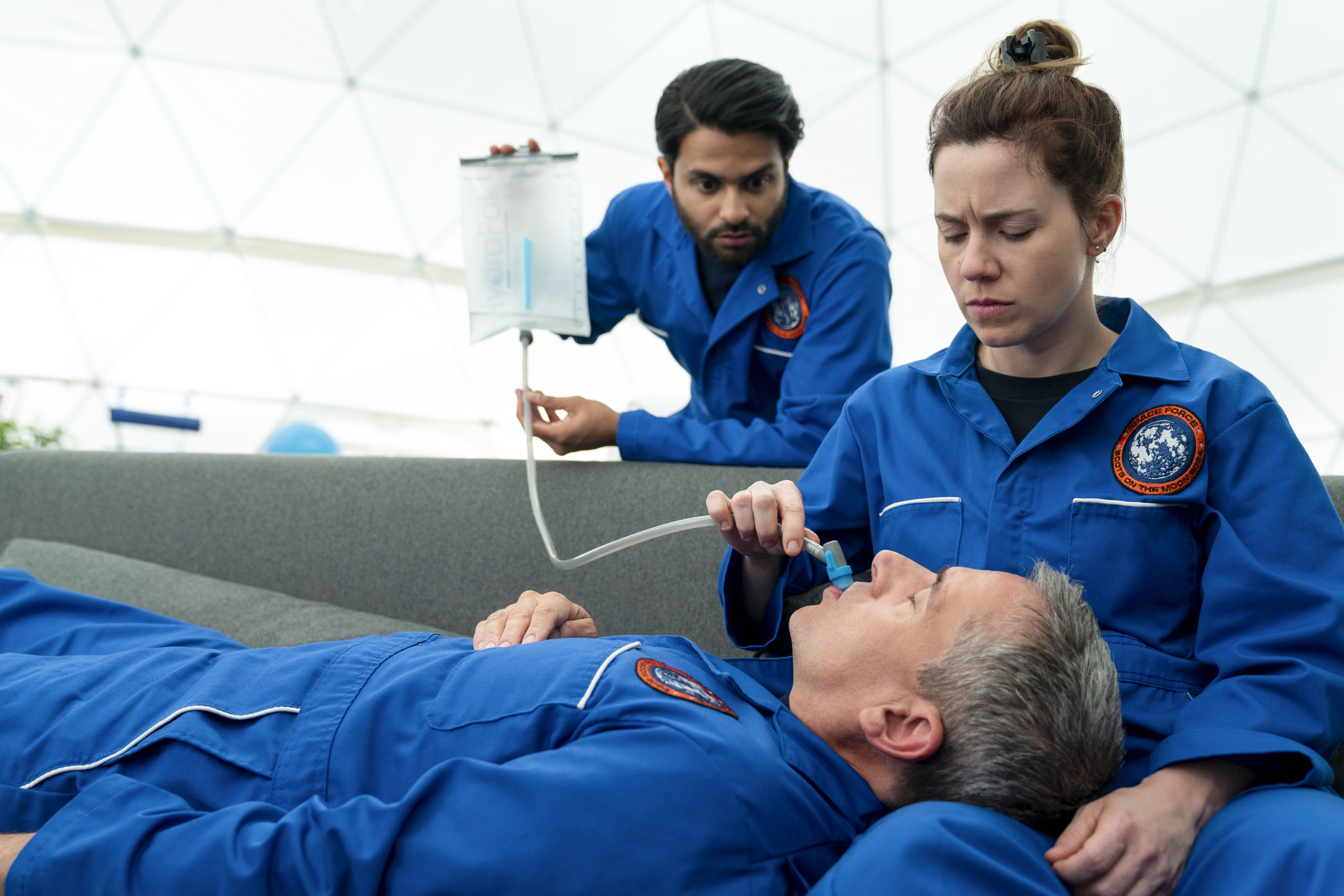 Man receiving medical treatment in space HD Wallpaper
