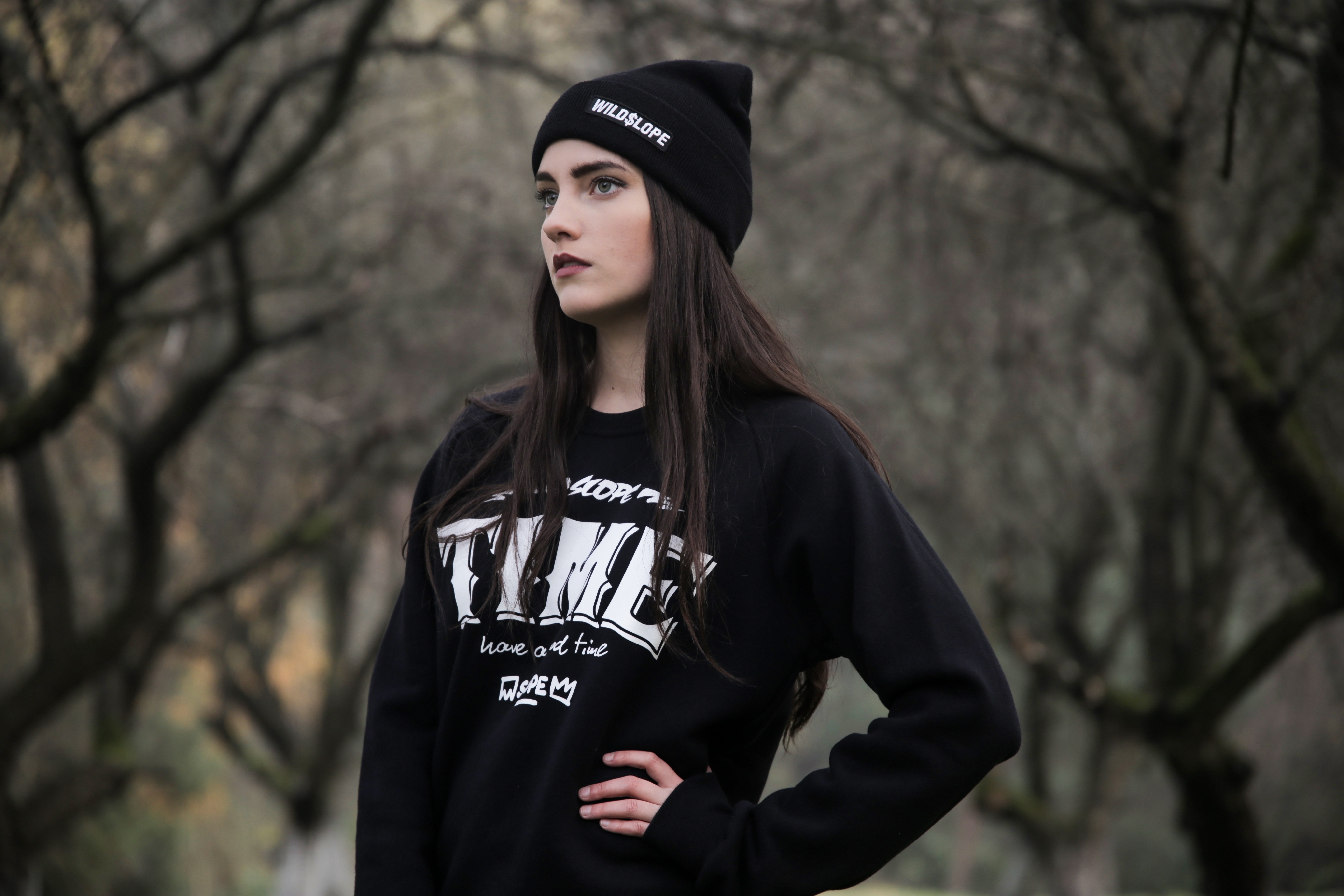 Model with black hair wearing a black beanie and sweatshirt HD Wallpaper
