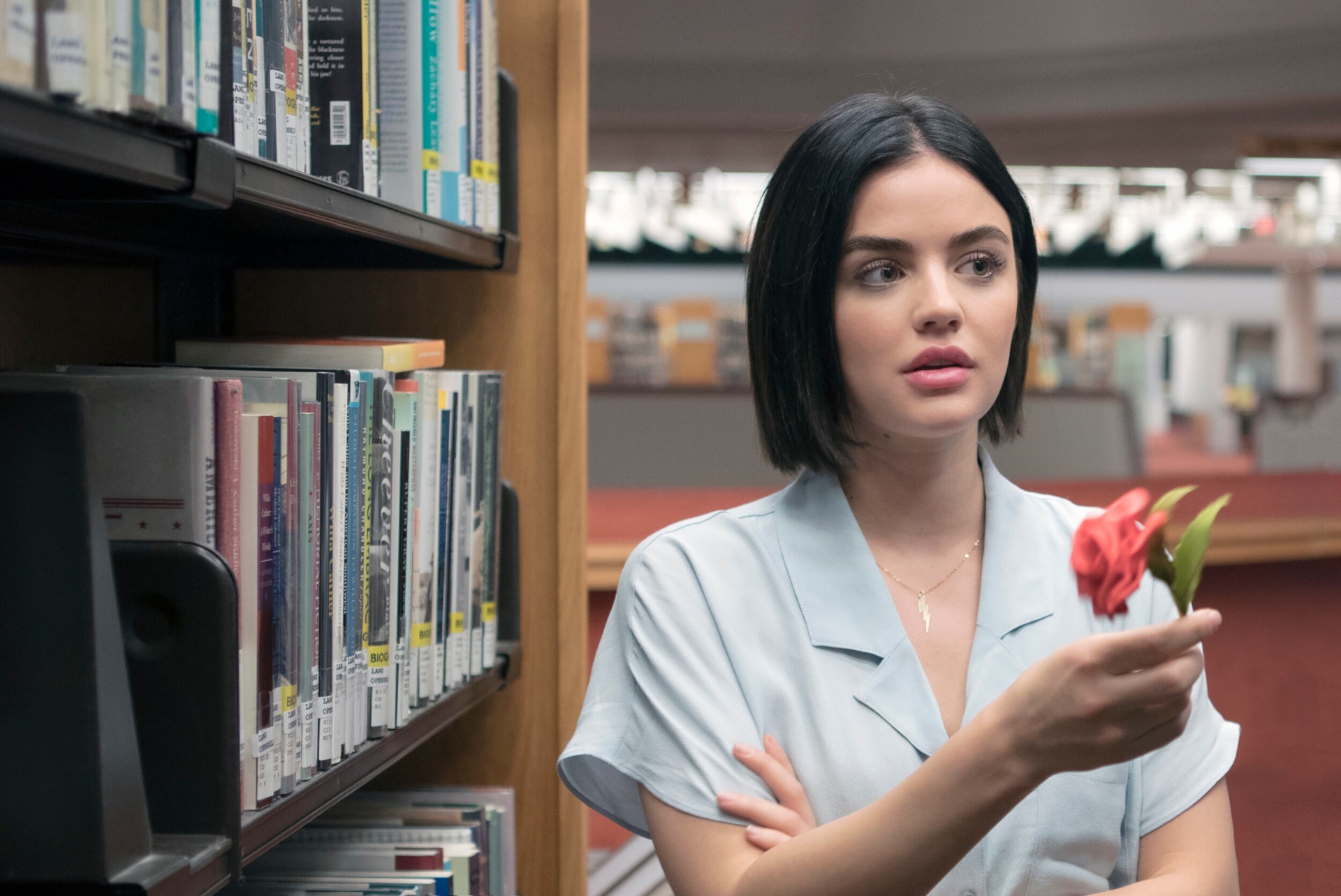 Lucy Hale in a Library Holding a Rose HD Wallpaper