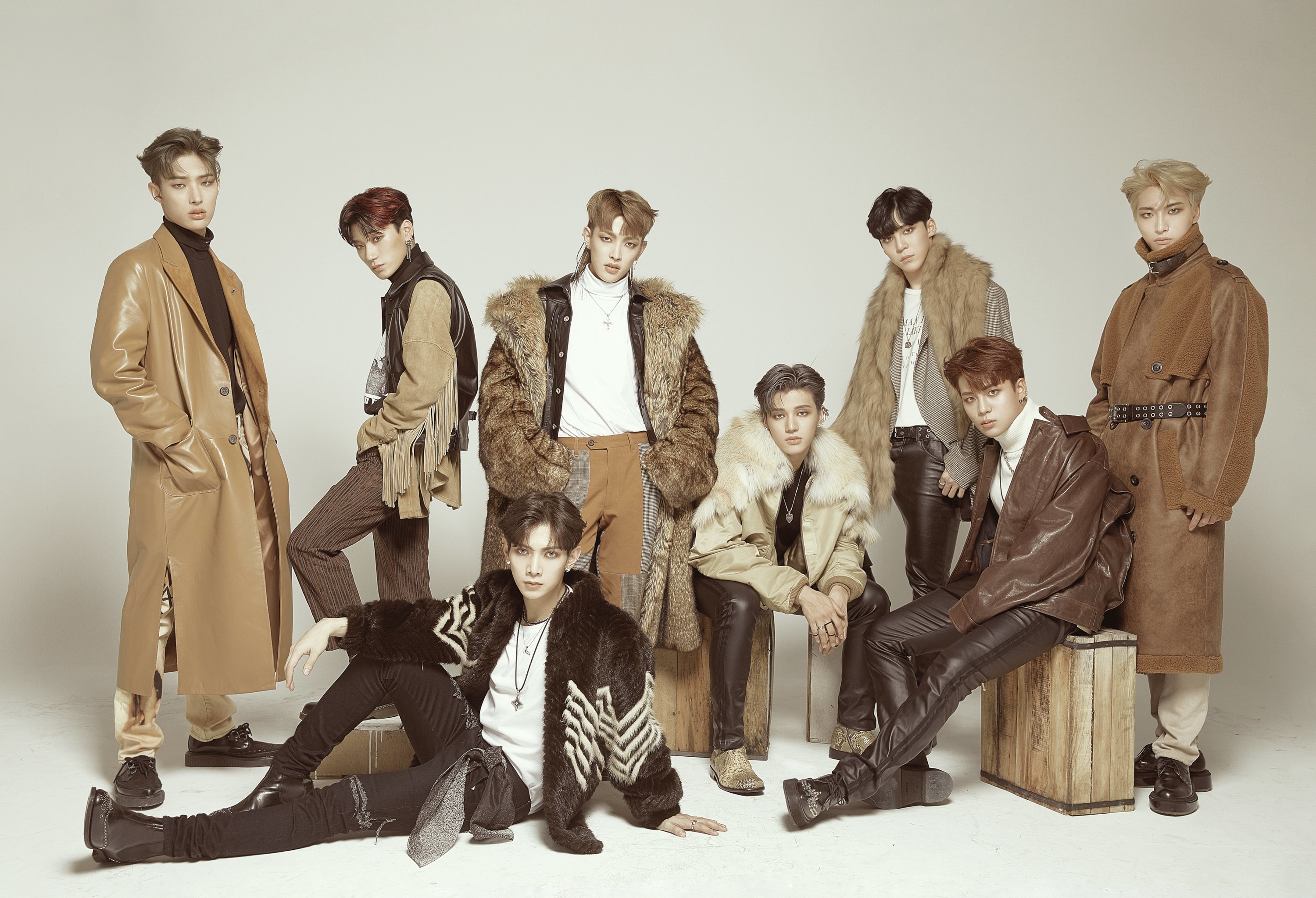 ATEEZ members posing in stylish fall fashion HD Wallpaper