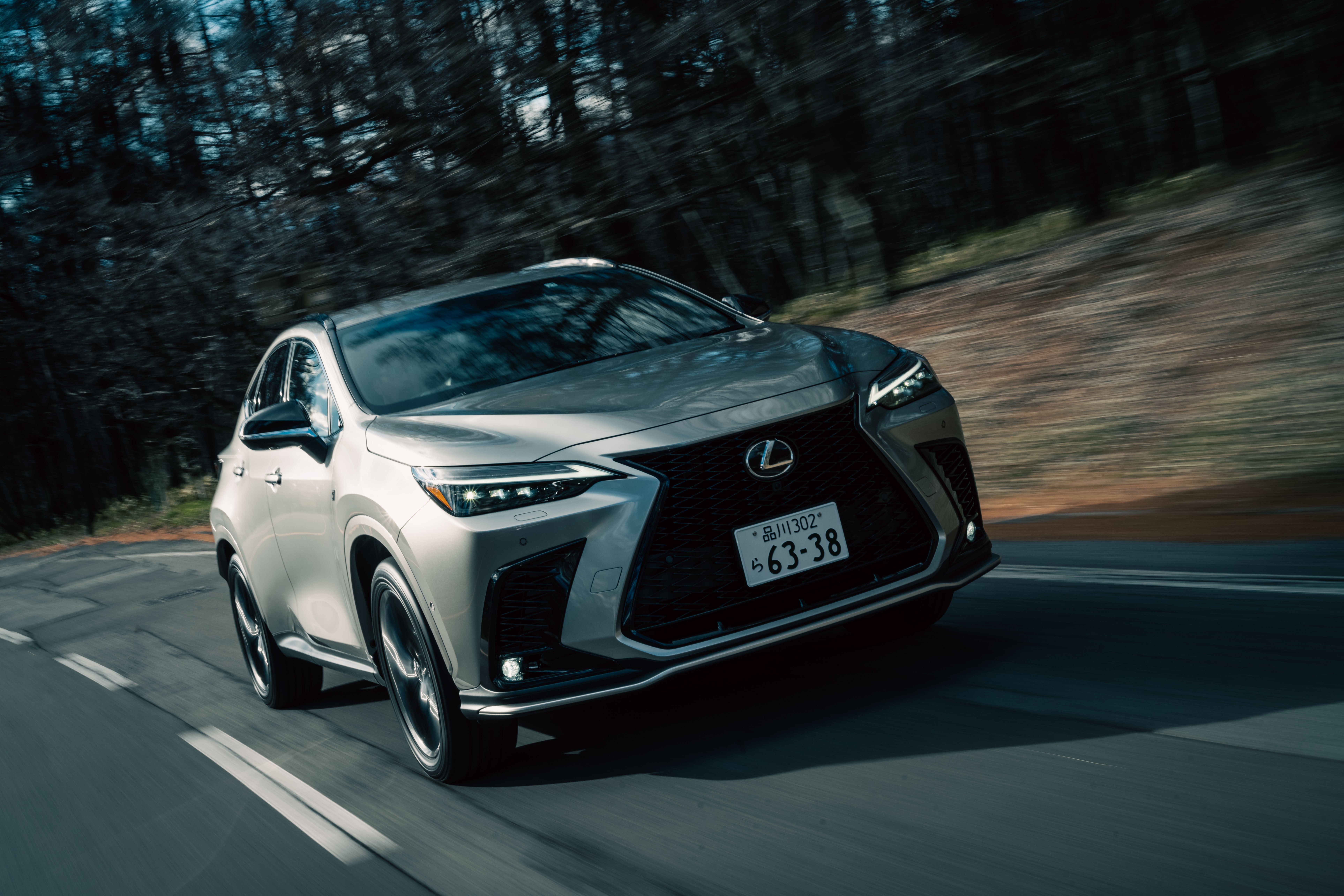 Lexus NX 350 F SPORT SUV driving on a road HD Wallpaper