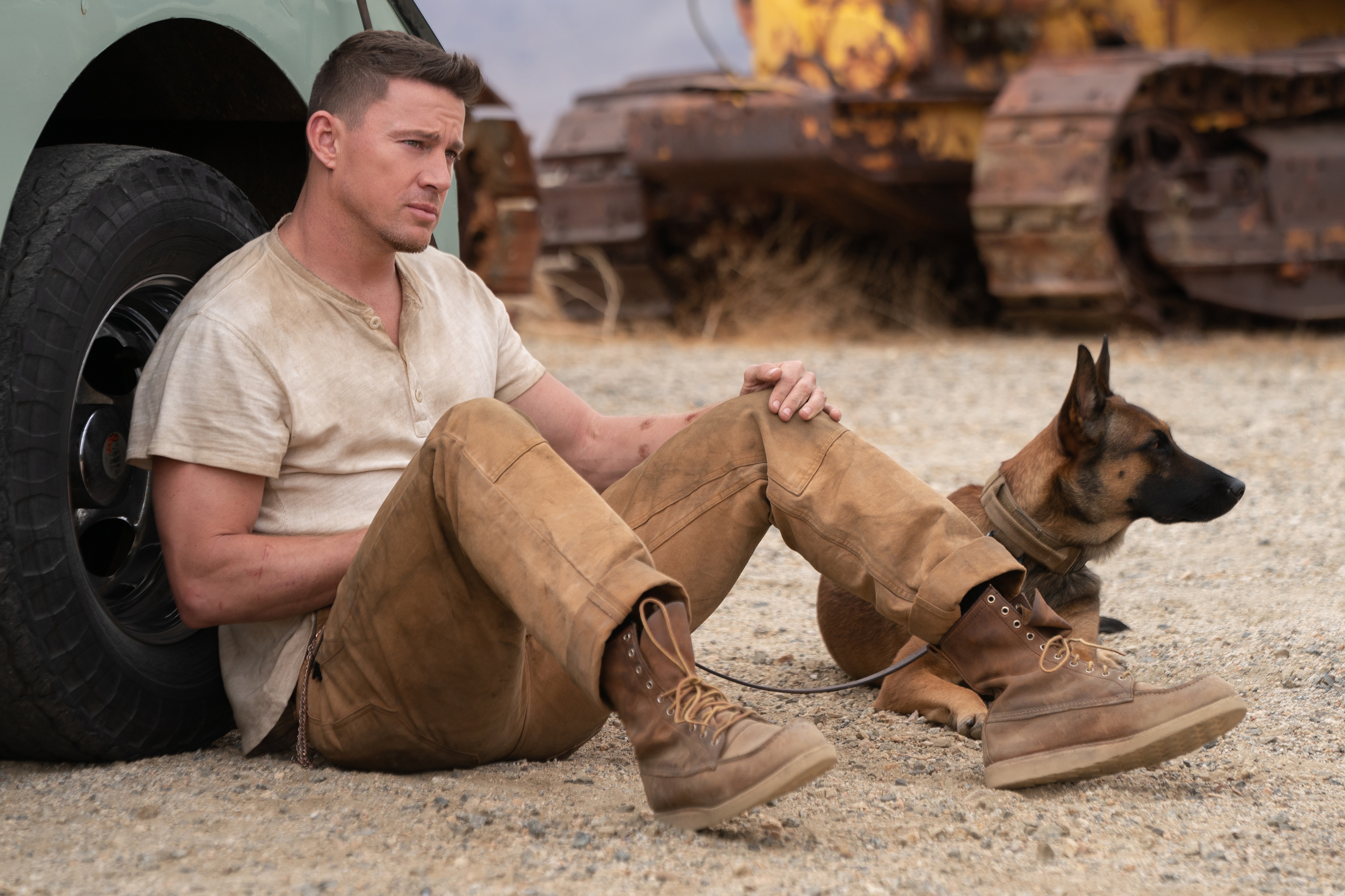 Channing Tatum and dog in a desert landscape HD Wallpaper