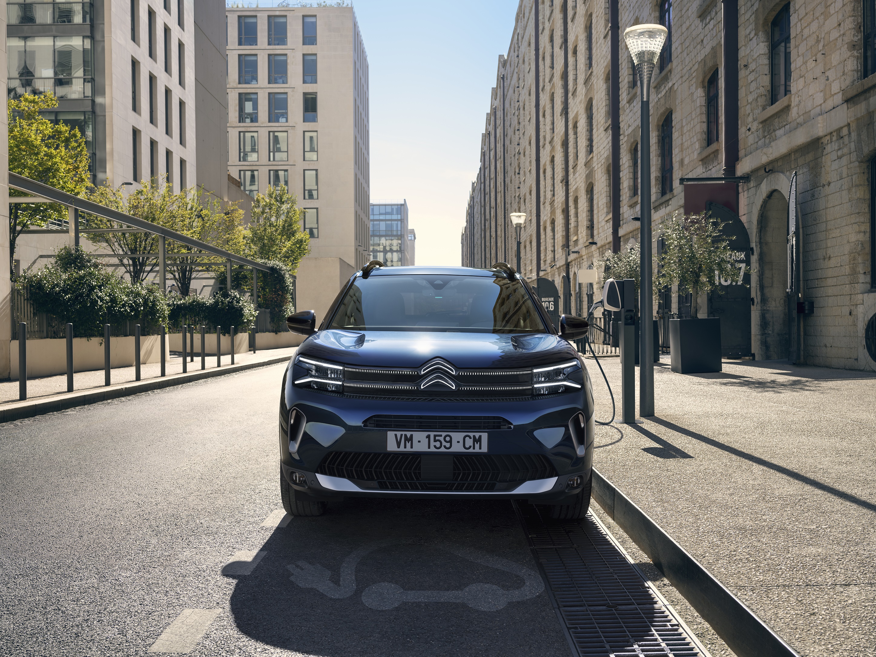 Citroen C5 Aircross SUV charging on a city street HD Wallpaper