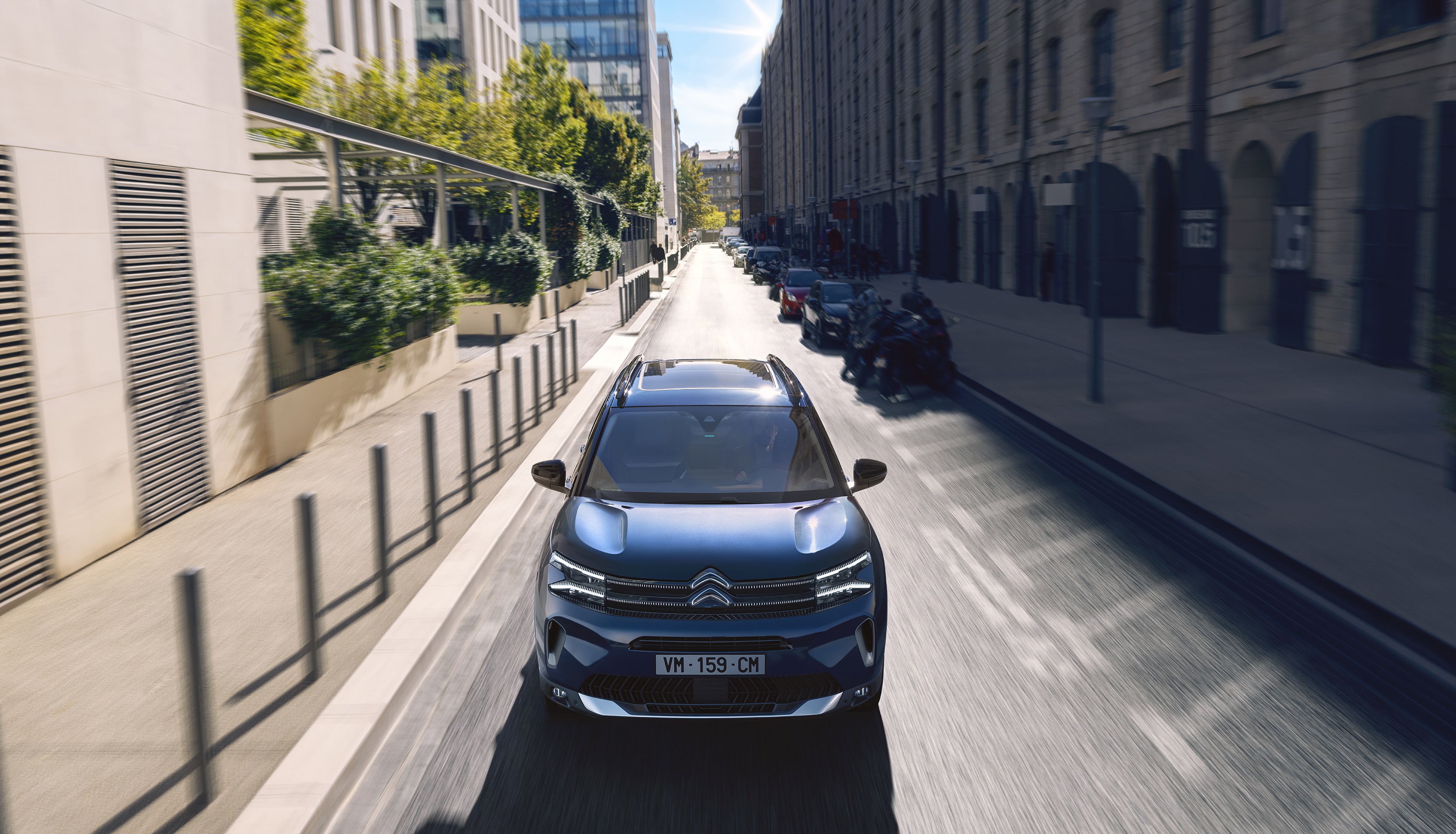 Blue Citroen C5 Aircross driving on a city street HD Wallpaper