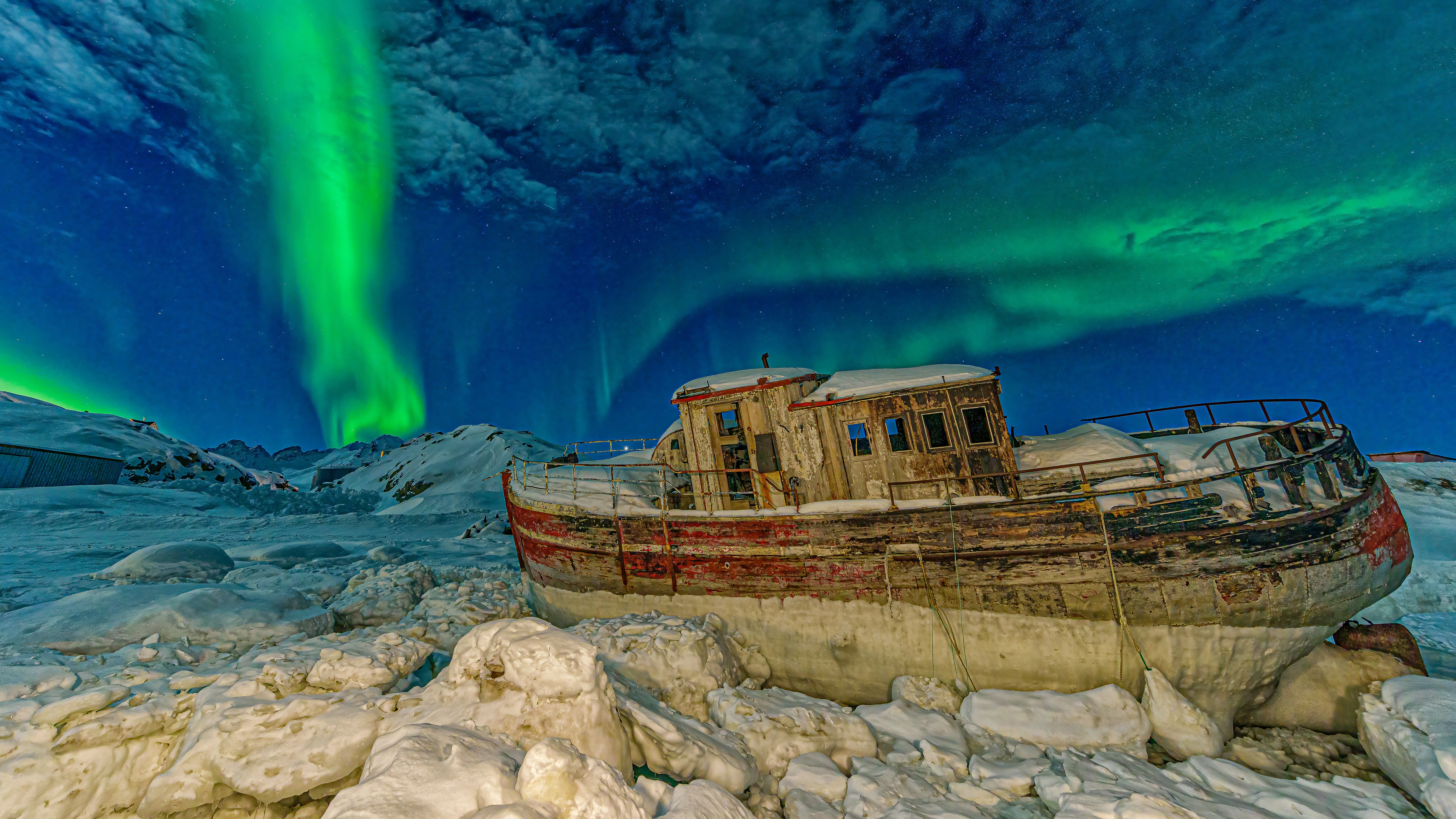 Aurora Borealis over abandoned boat in Tasiilaq, Greenland HD Wallpaper