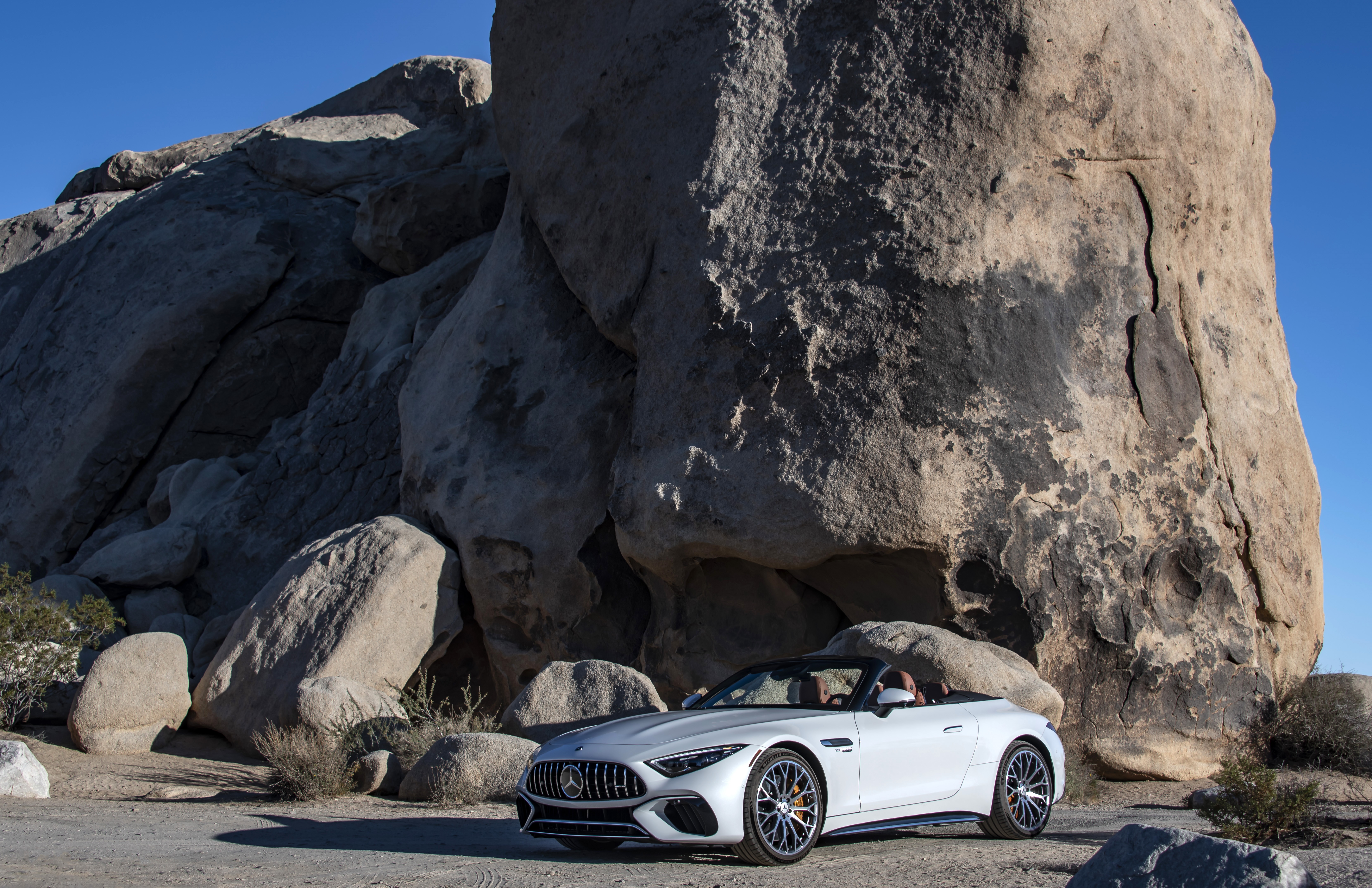 White Mercedes-AMG SL Cabriolet in desert landscape HD Wallpaper