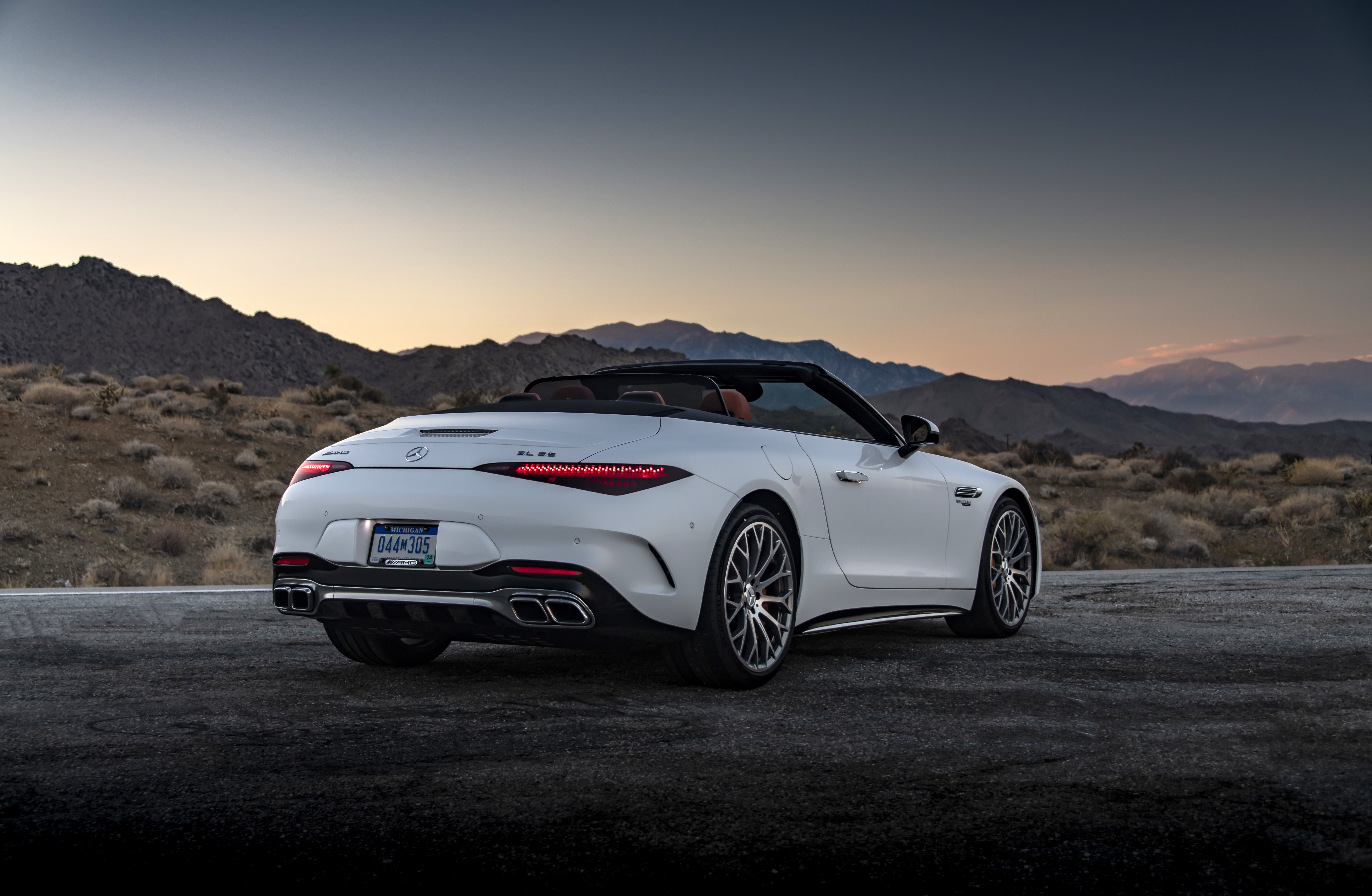 White Mercedes-AMG SL 55 4MATIC Cabriolet in desert landscape HD Wallpaper