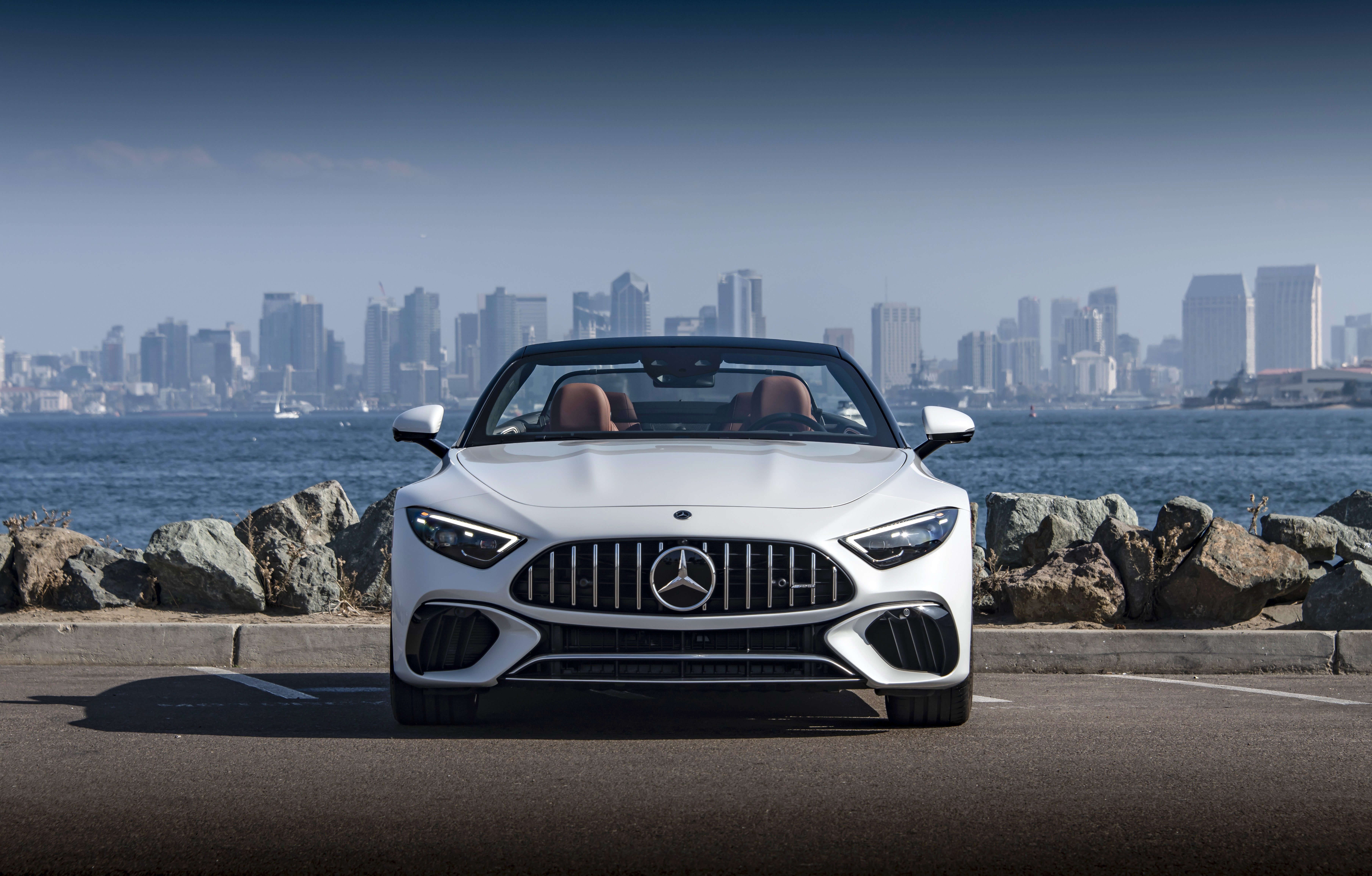White Mercedes-AMG SL Cabriolet in front of San Diego skyline HD Wallpaper