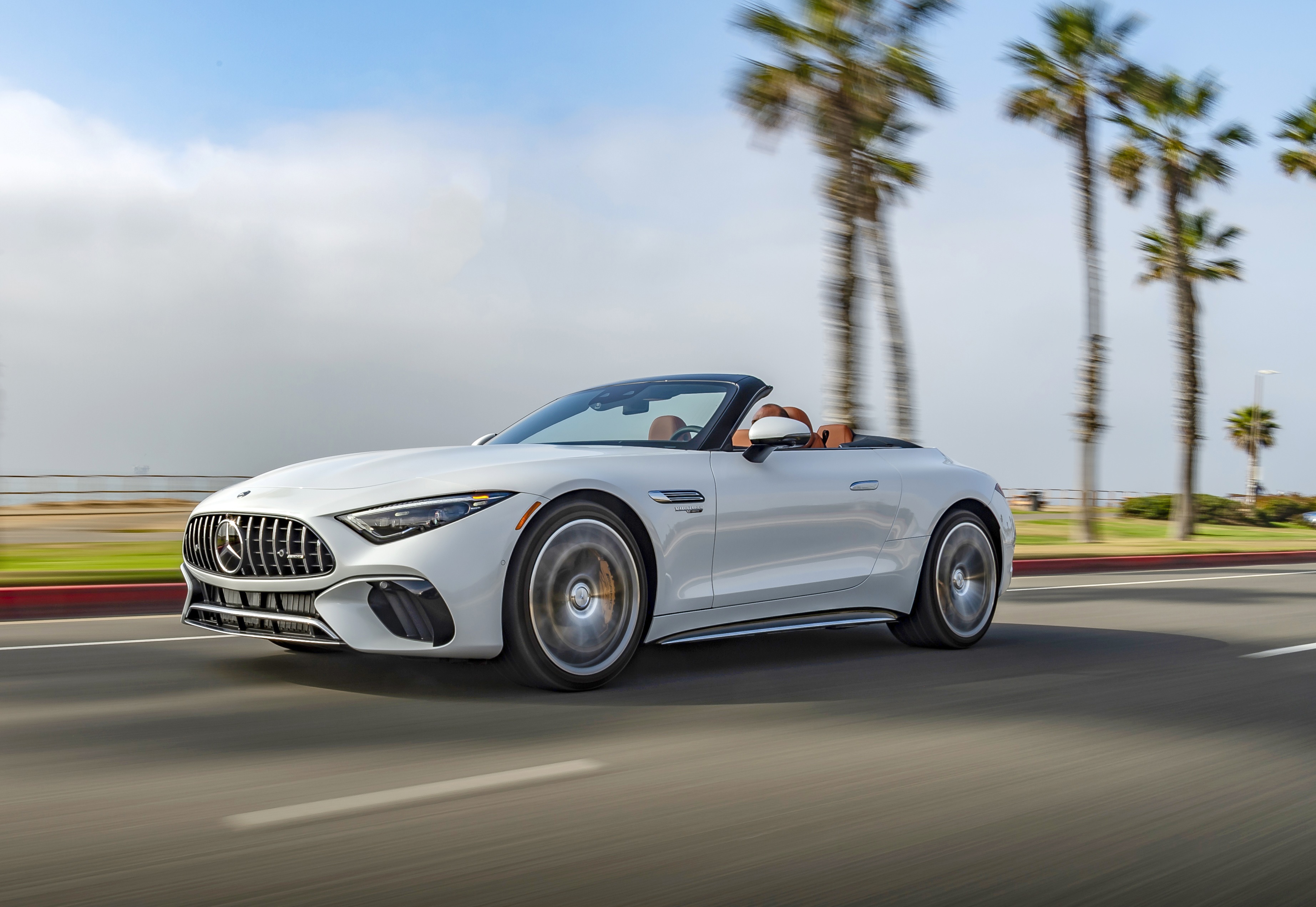 White Mercedes-AMG SL Cabriolet driving on a road HD Wallpaper