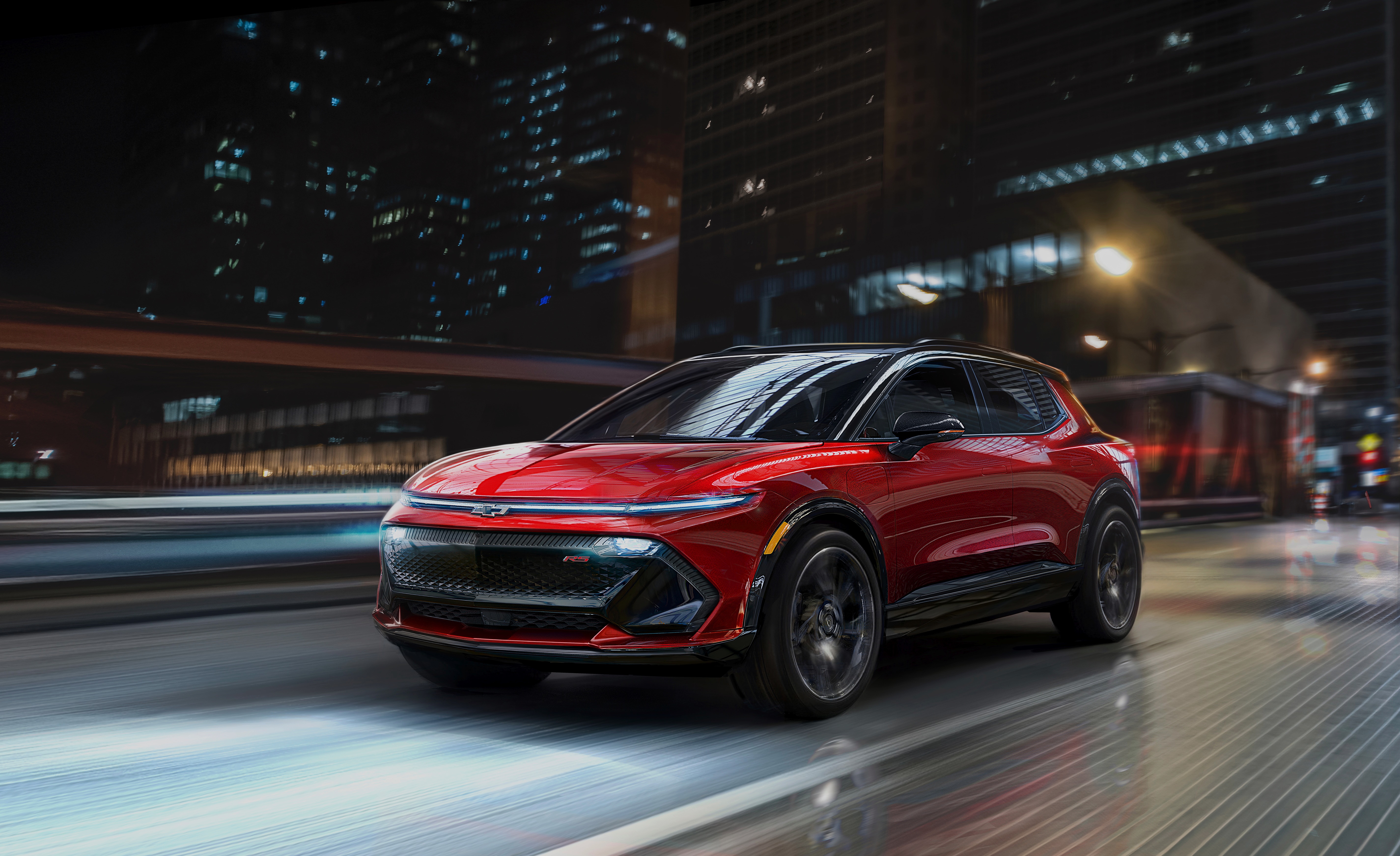 2024 Chevrolet Equinox EV driving at night HD Wallpaper