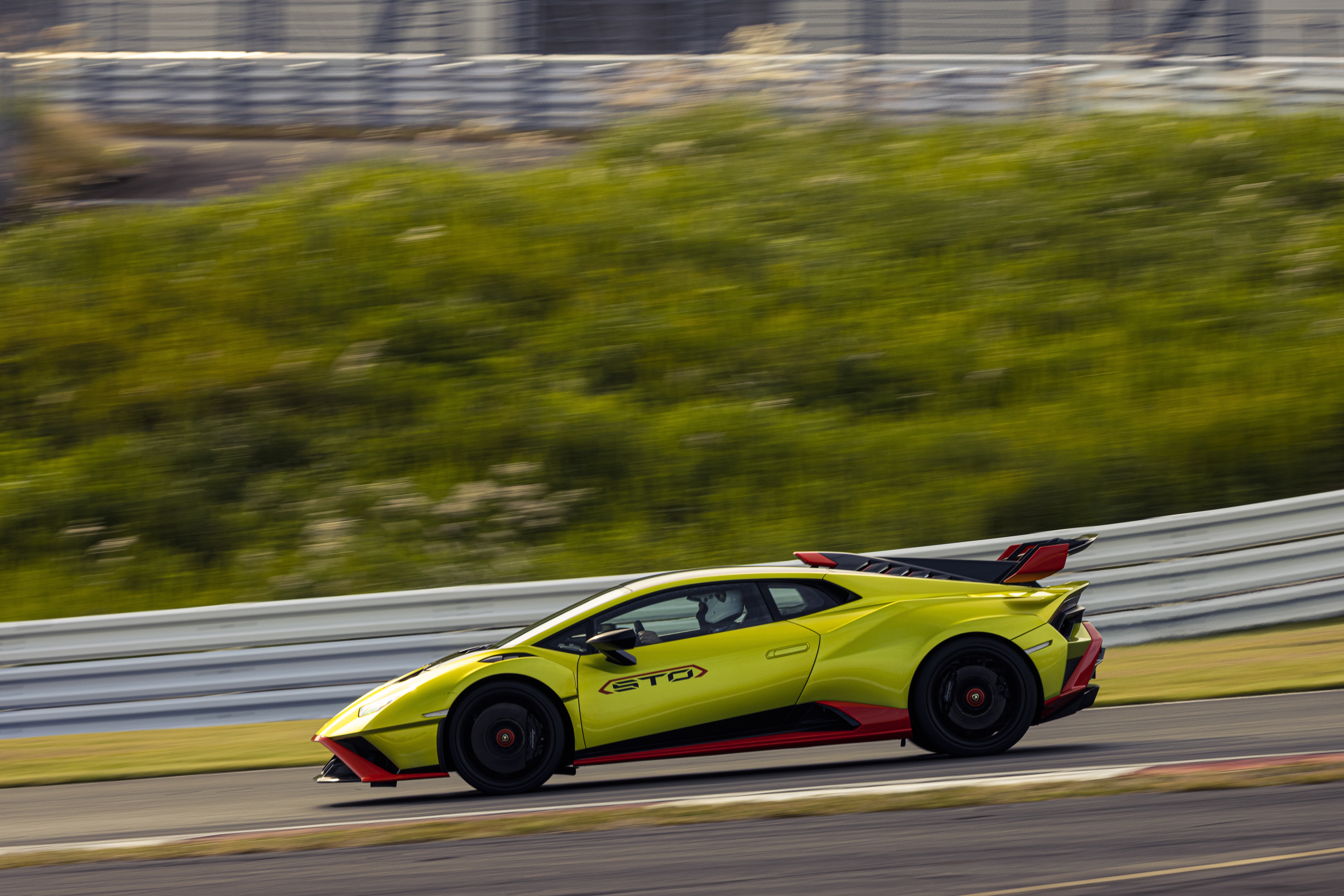 Lamborghini Huracán STO on a race track HD Wallpaper