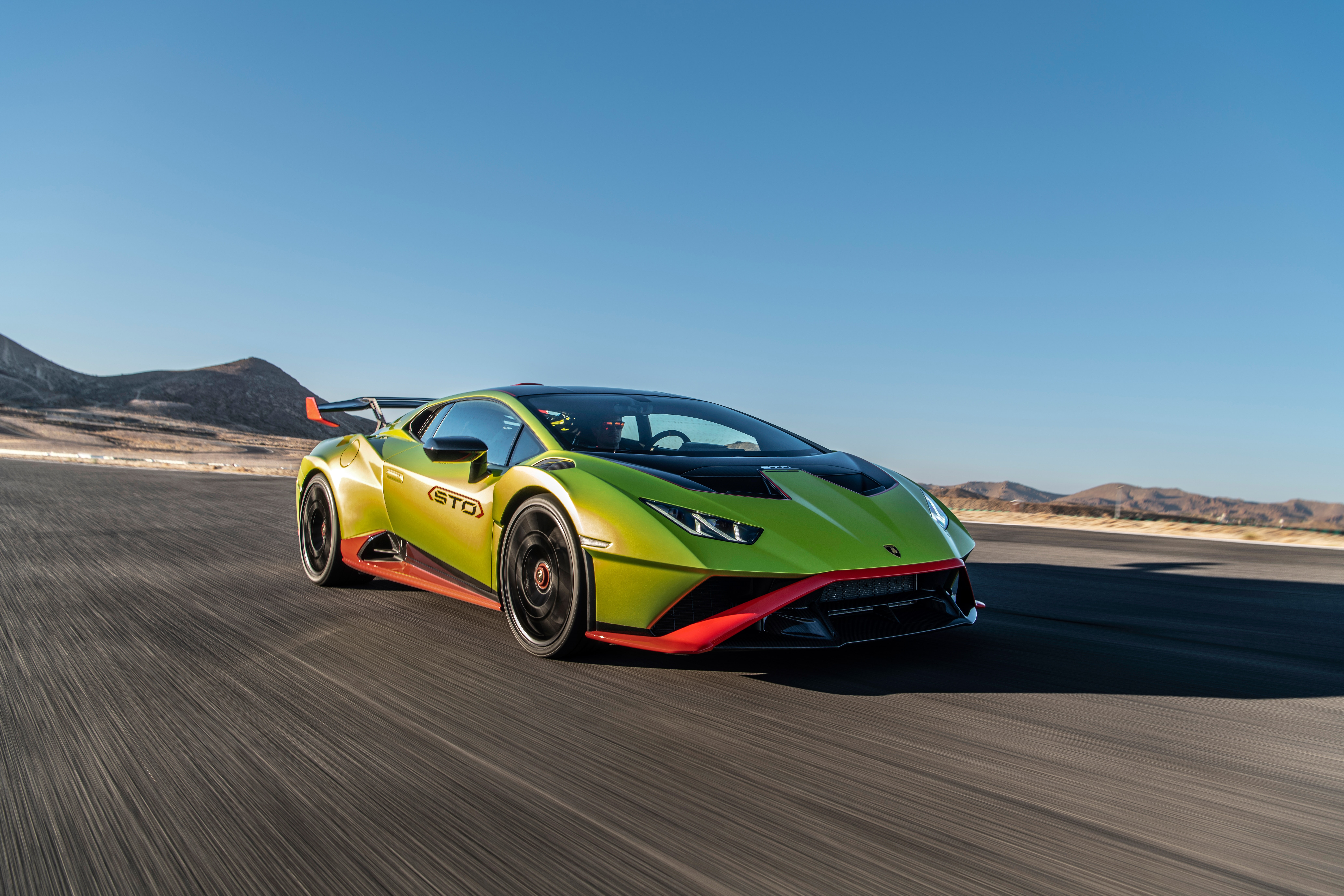 Lamborghini Huracán STO on a race track HD Wallpaper