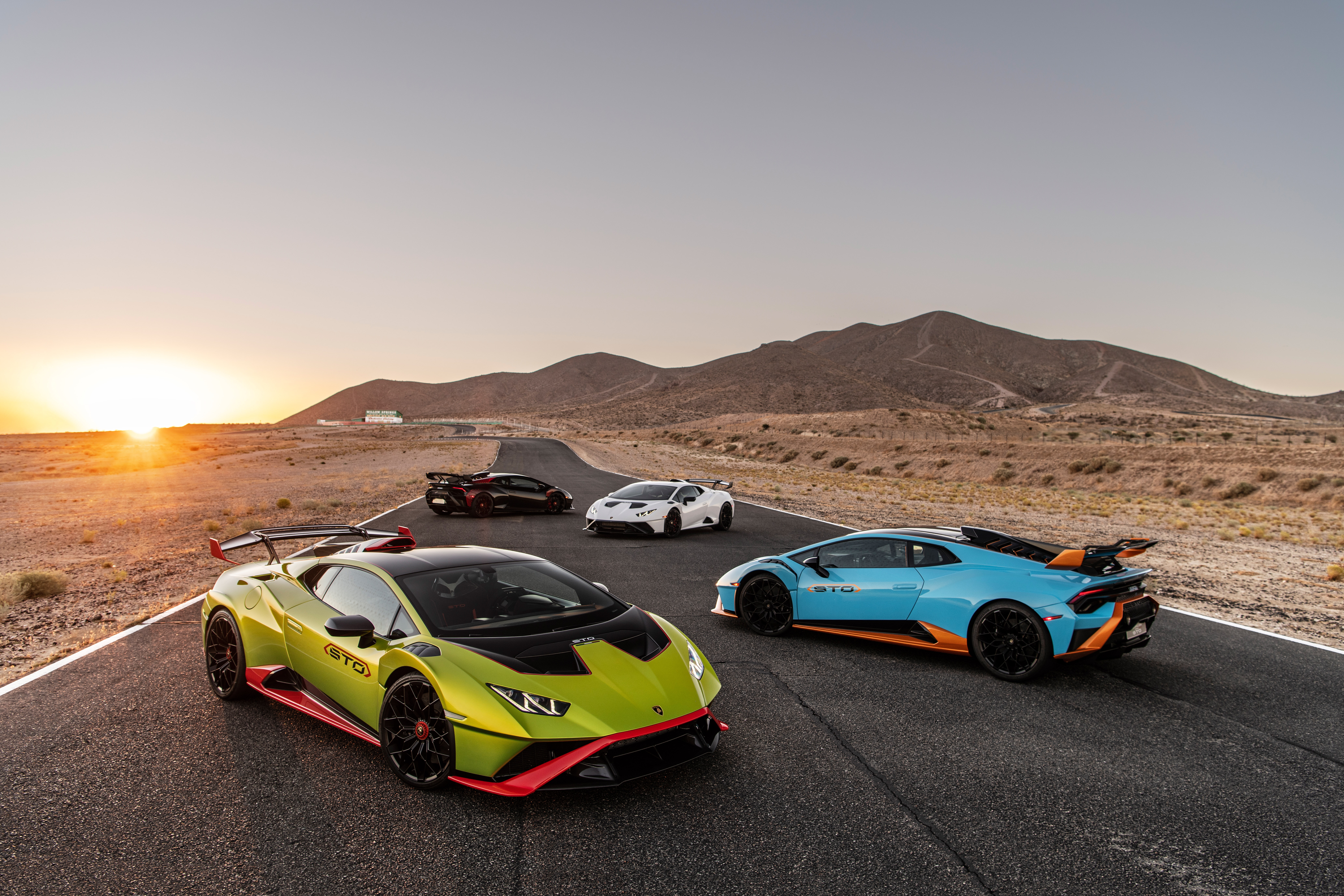 Lamborghini Huracán STO cars on a desert road HD Wallpaper
